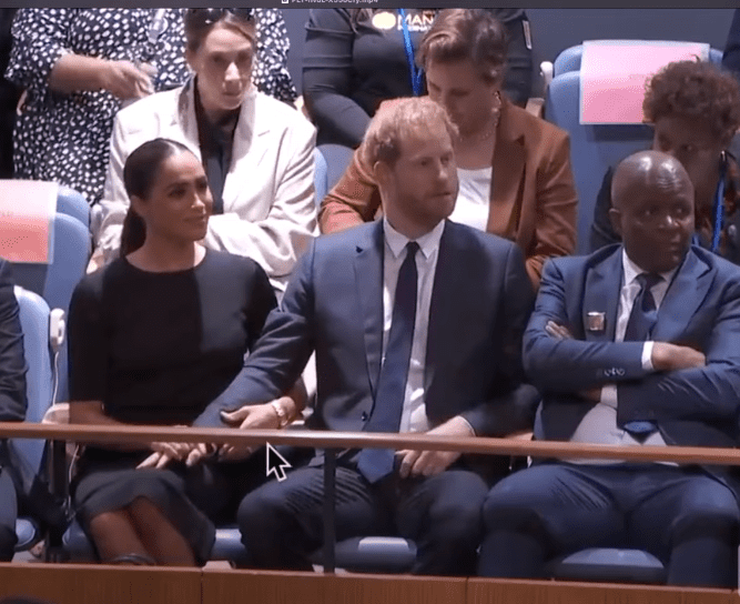 A screengrab of Meghan Markle grabbing her husband, Prince Harry's arm during the United Nations General Assembly on July 18, 2022 in New York City.┃Source: YouTube/@TheBodyLanguageGuy