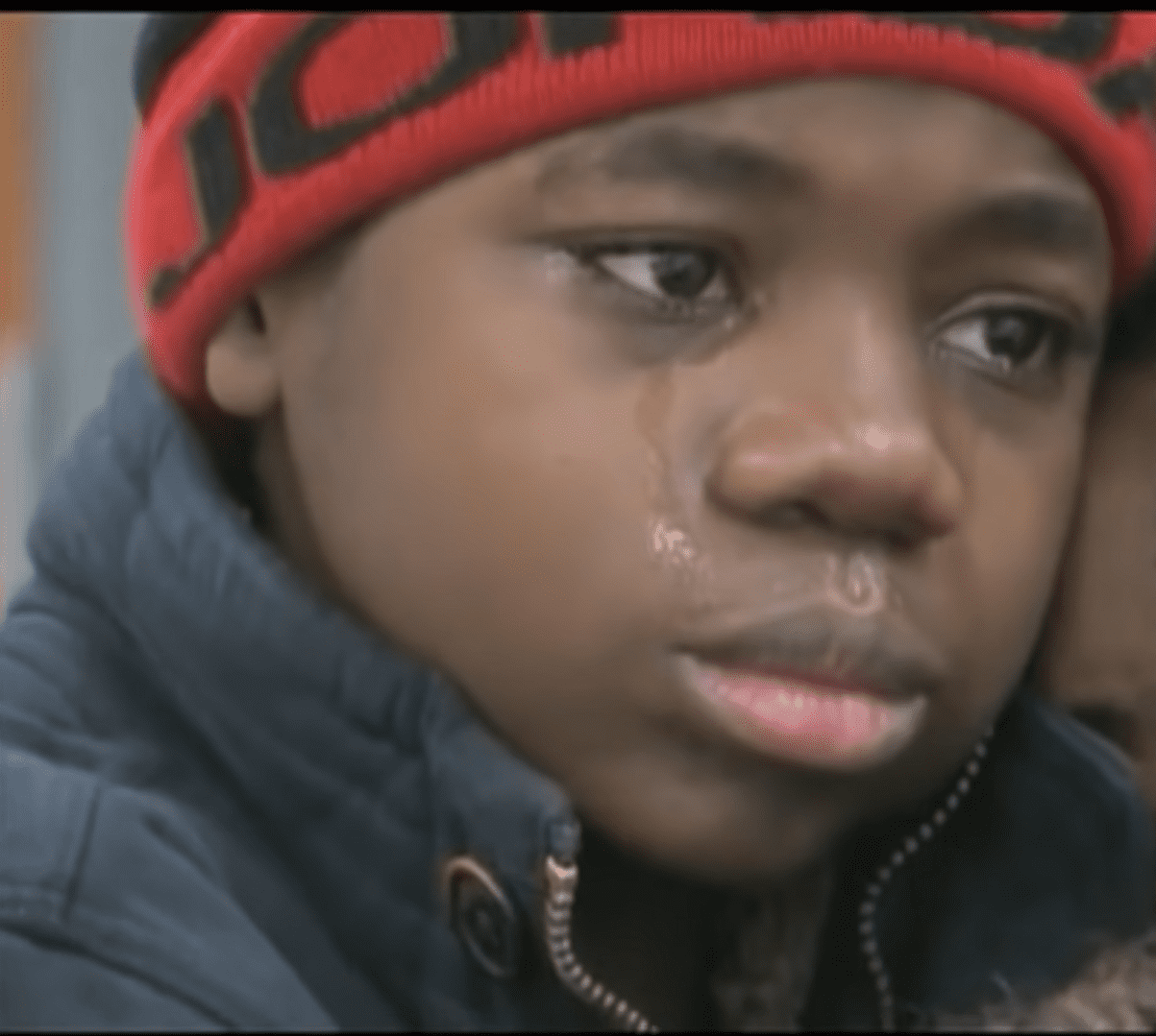 The teen boy crying. | Source: youtube.com/CBS Evening News