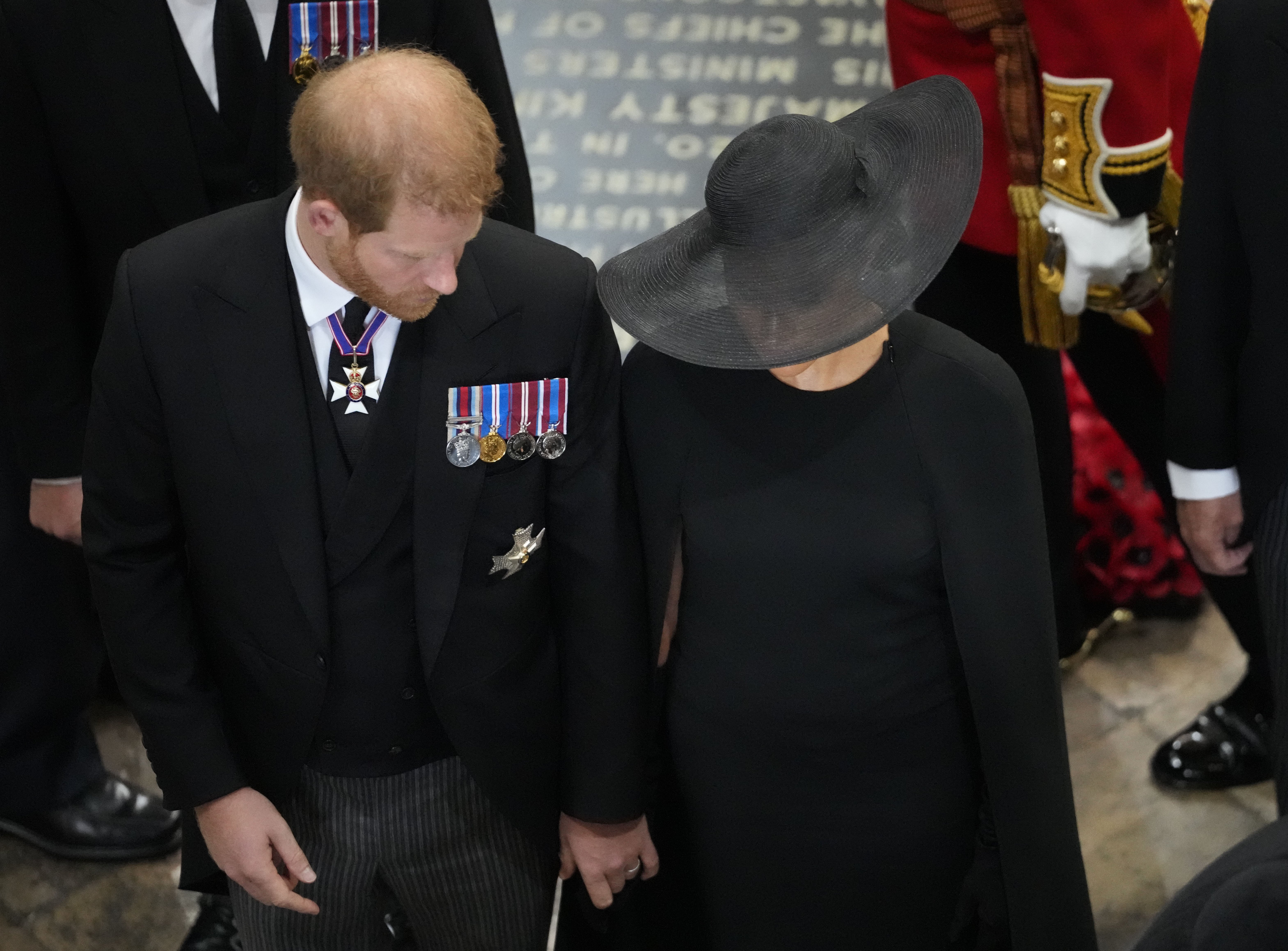 Prince Harry and Duchess Meghan follow the coffin of Queen Elizabeth II as it is carried out of Westminster Abbey on September 19, 2022, in London, England | Source: Getty Images