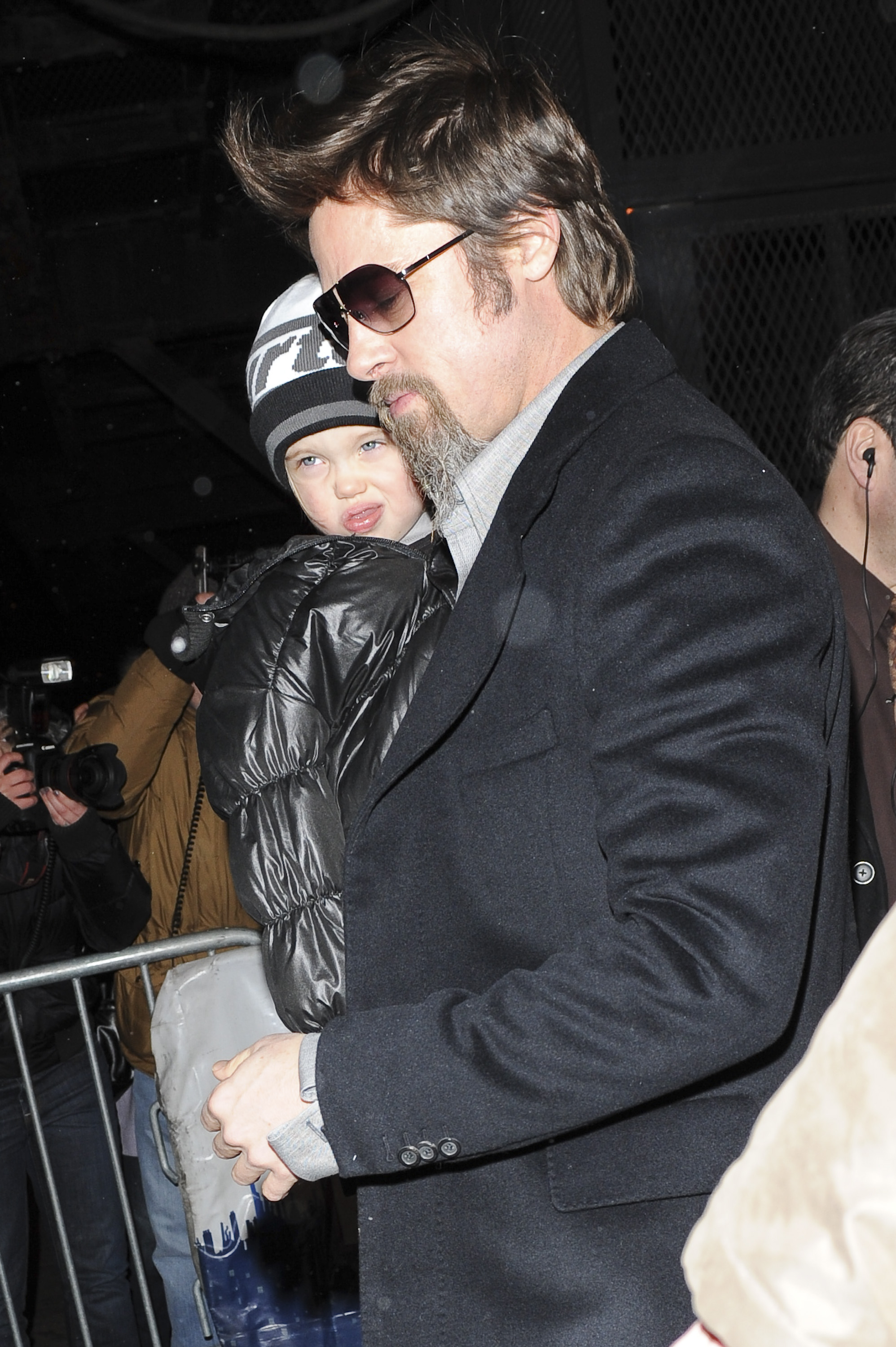 Brad Pitt (R) and Shiloh Nouvel Jolie-Pitt leave the "Mary Poppins" show at the New Amsterdam Theater on January 03, 2010 in New York City | Source: Getty Images