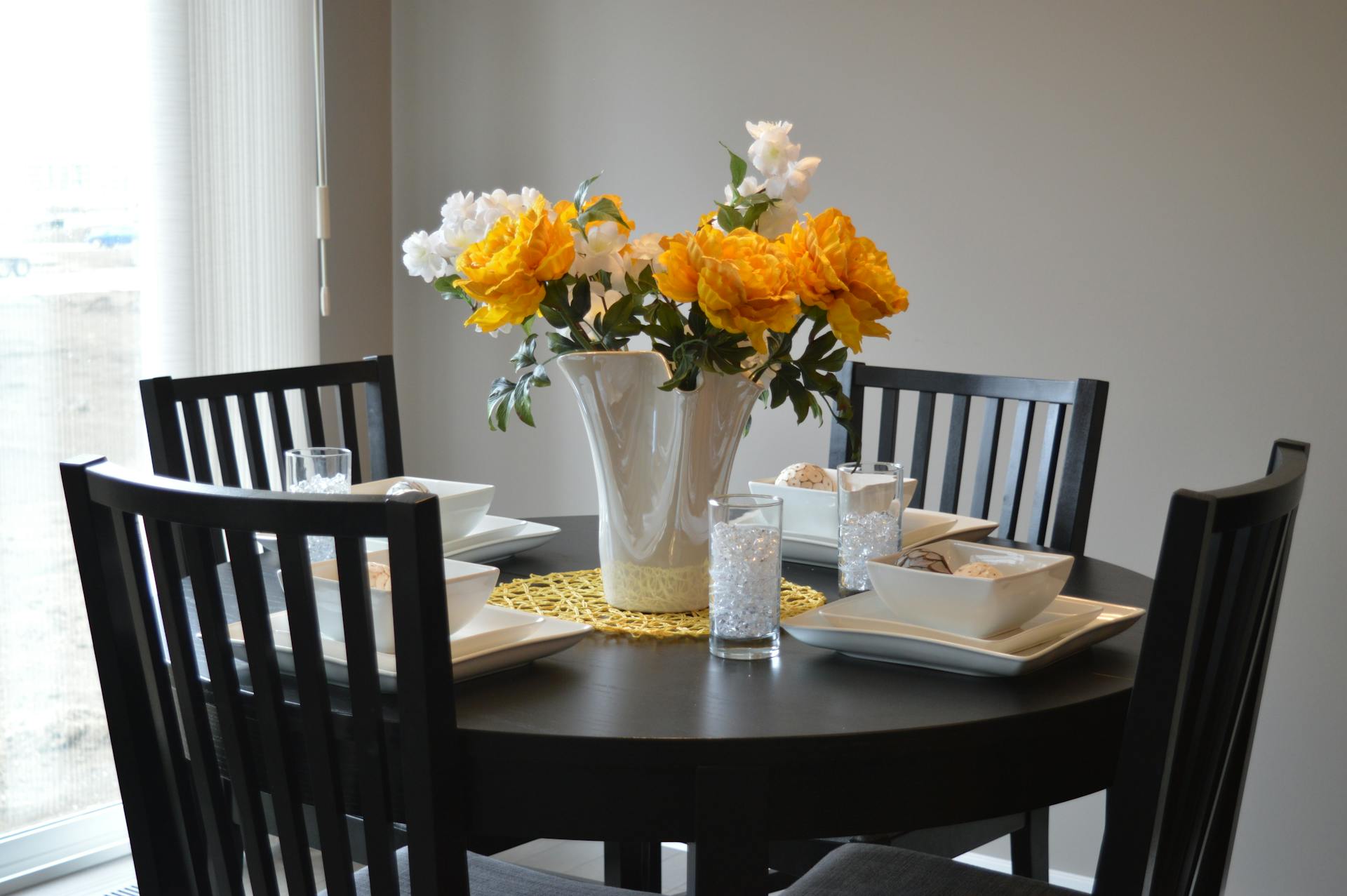 A white ceramic vase on a dining table | Source: Pexels