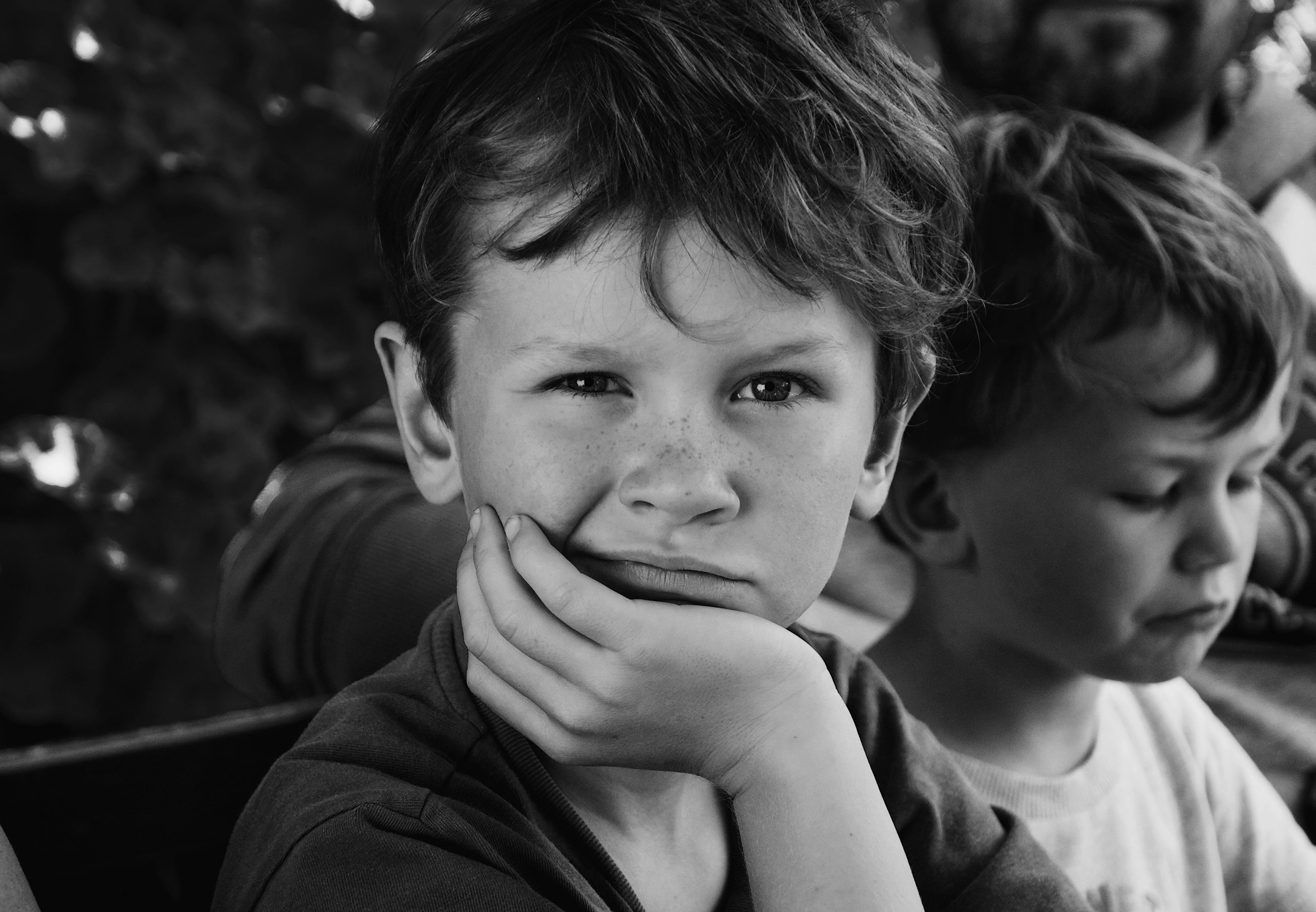 Two children sitting next to each other | Source: Pexels