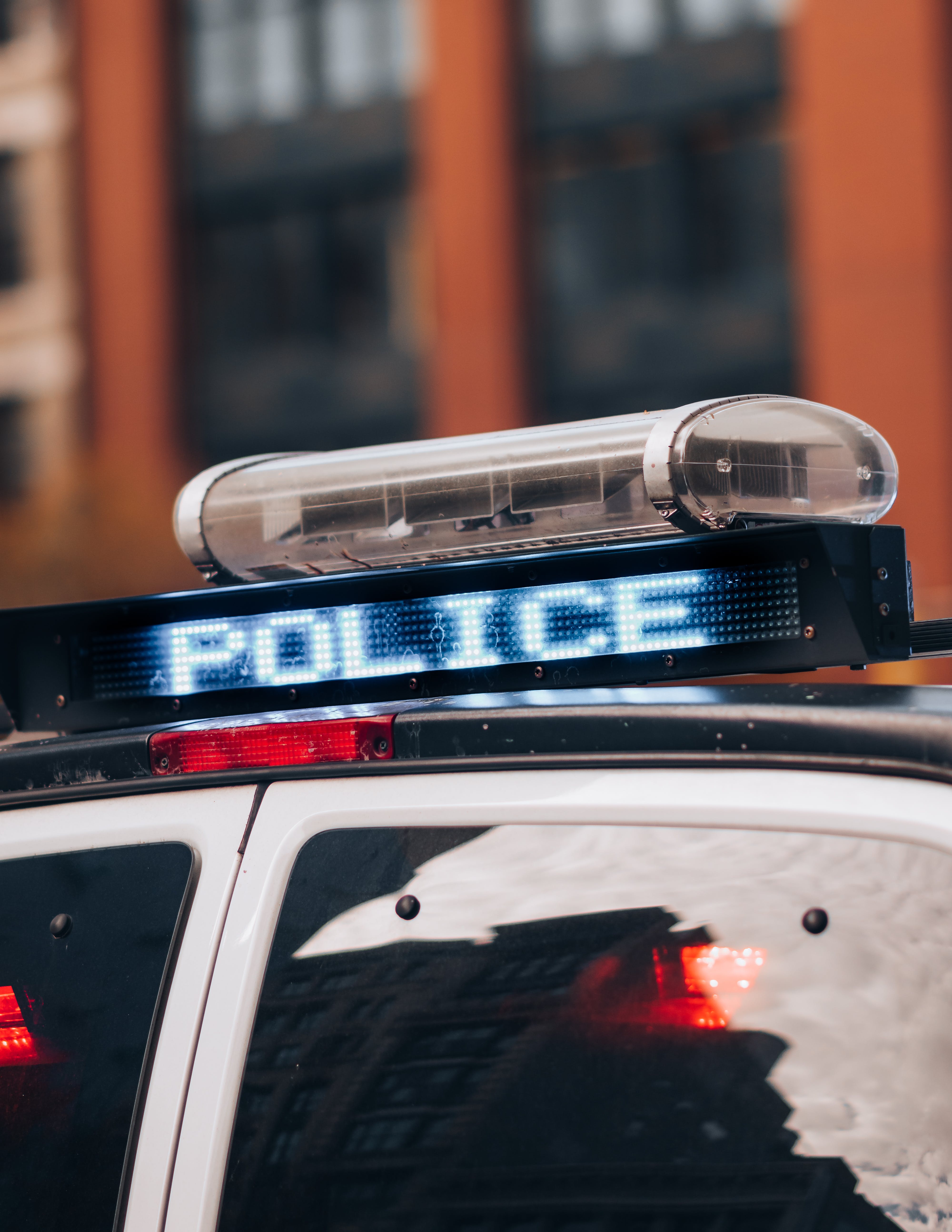 A close-up photo of a police car roof and sign | Source: Pexels