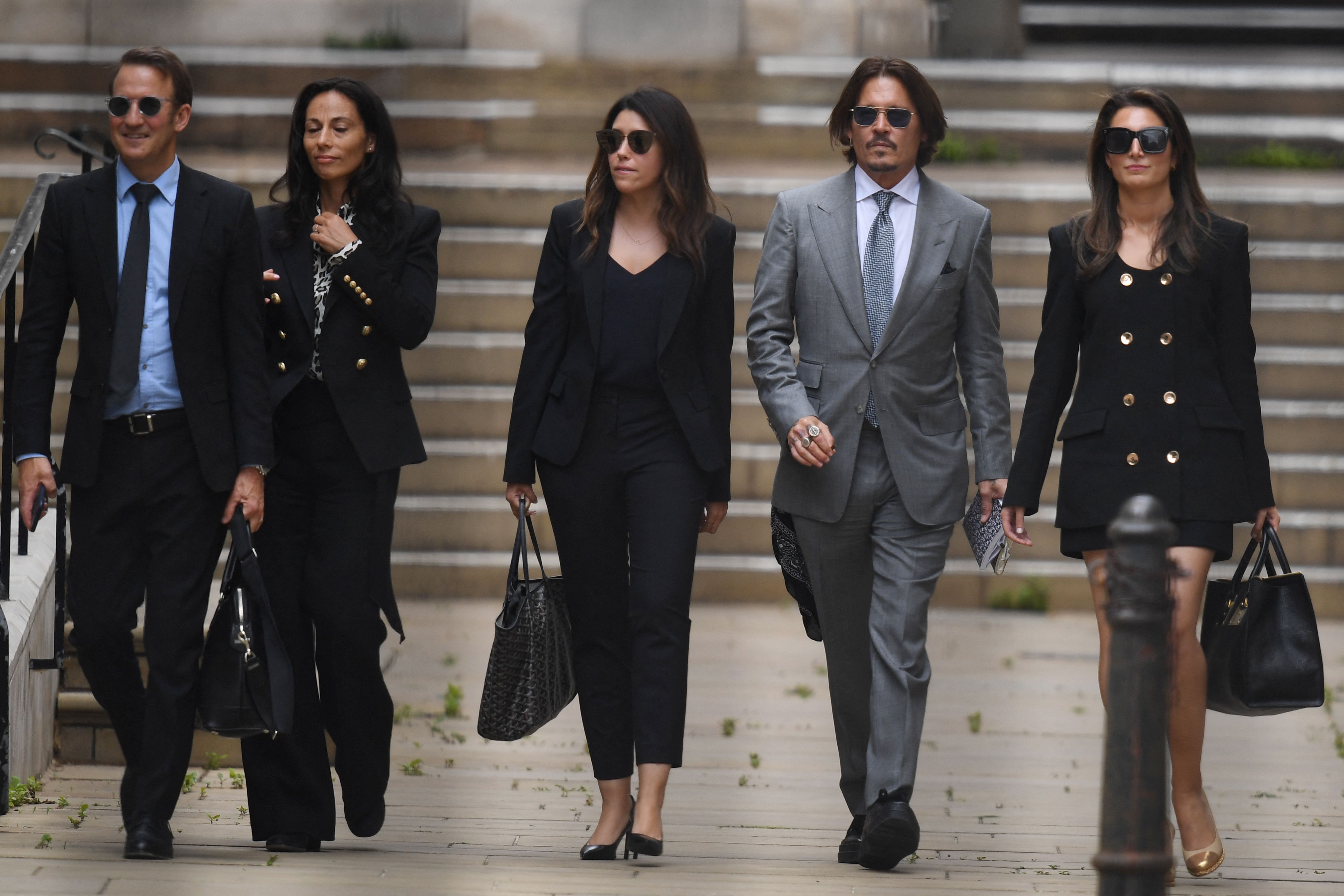 Lawyer Adam Waldman photographed with Johnny Depp and fellow colleagues at the High Court on July 16, 2020 in London | Source: Getty Images