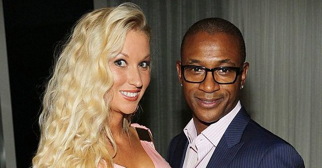Amanda Moore and Tommy Davidson pose at the Haute Living OMEGA Dark Side of the Moon Watch event hosted by Larsa and Scottie Pippen on December 4, 2013 in Miami Beach, Florida. | Photo: Getty Images