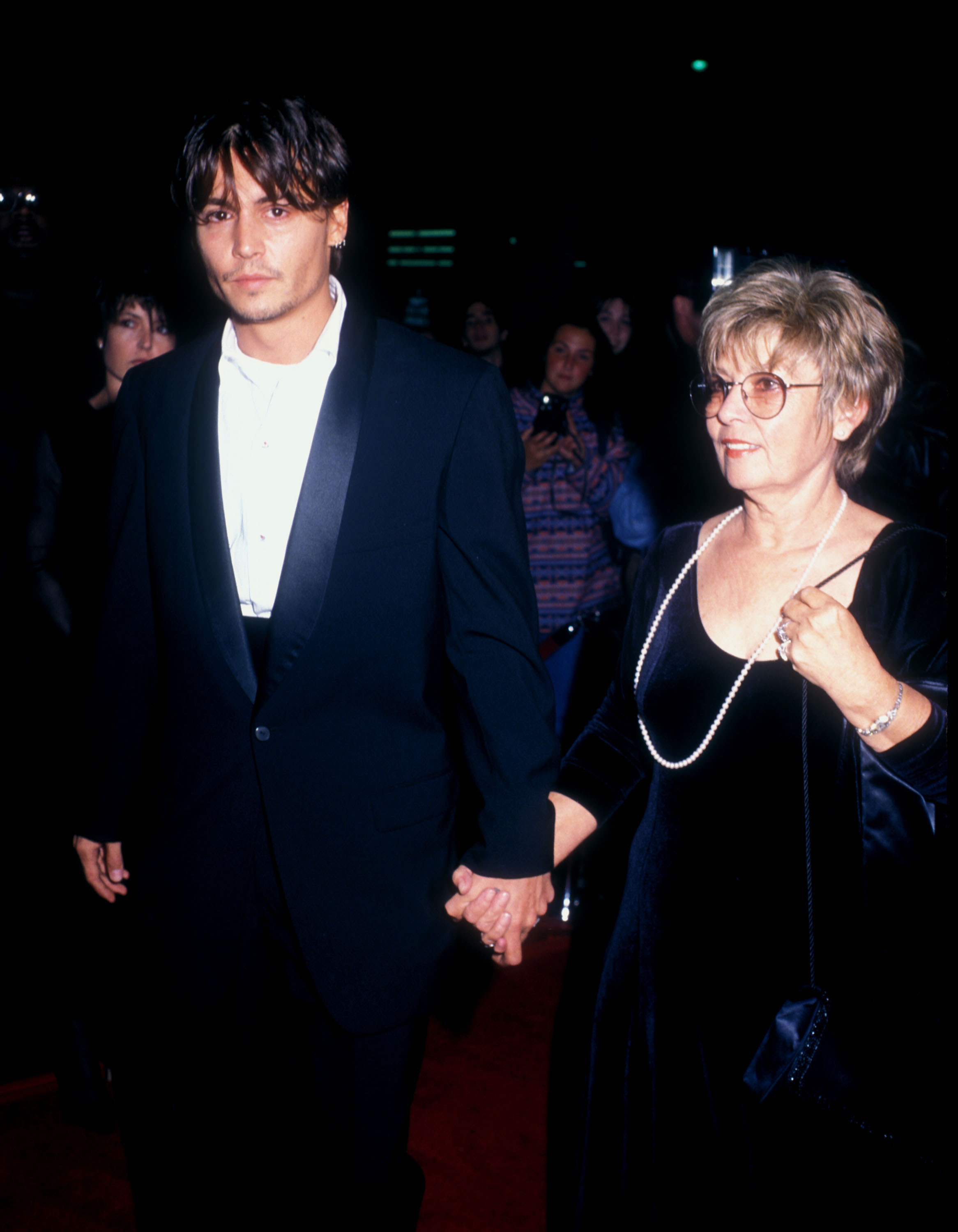 Johnny Depp and his mother at the premiere of "Nick of Time" on November 20, 1995, in Beverly Hills, California. | Source: Getty Images