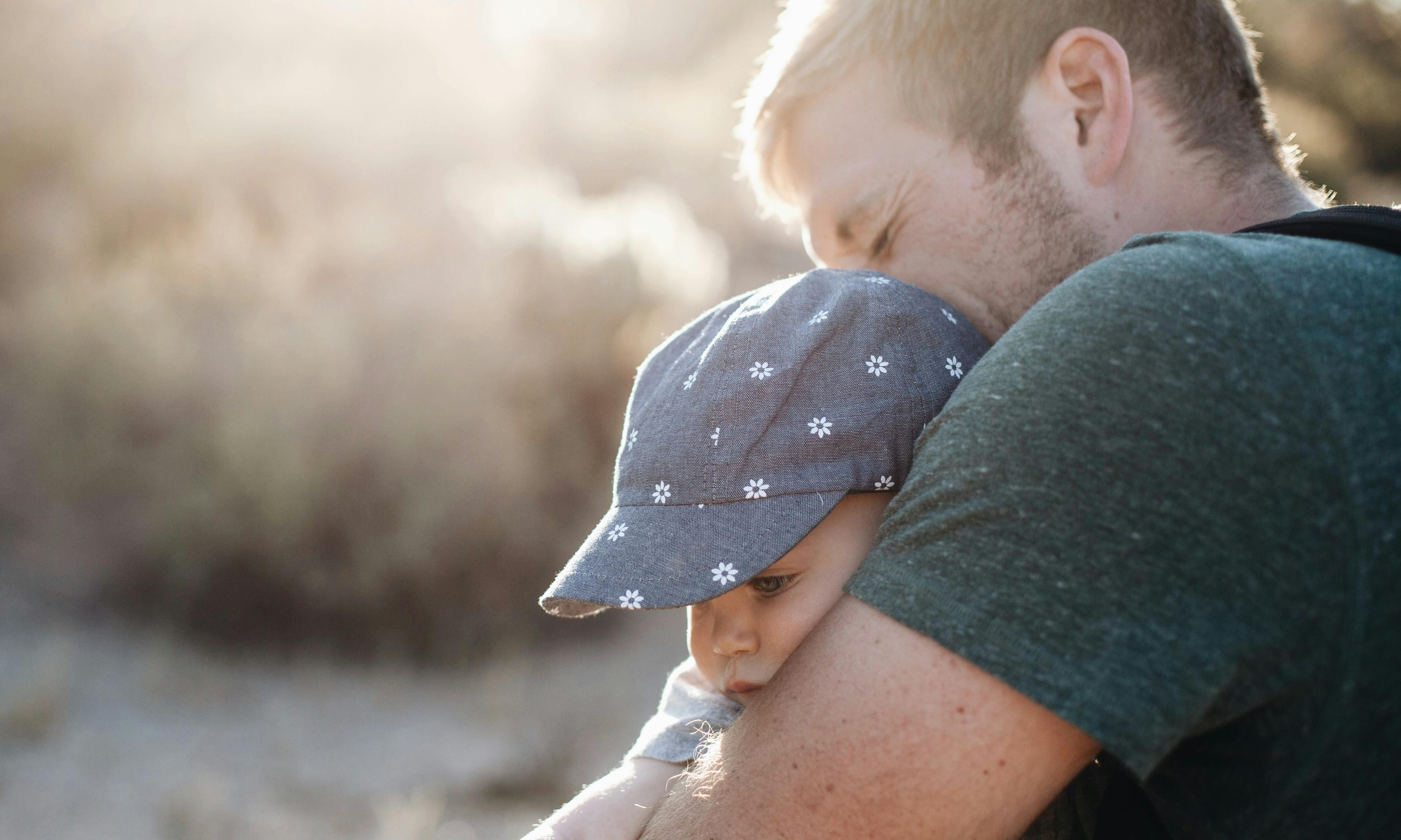 A man lovingly interact with a baby | Source: Pexels