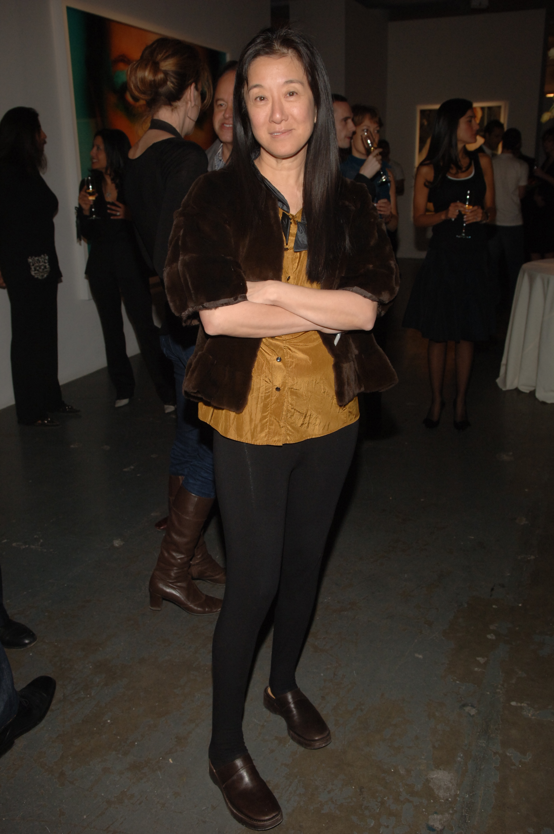 The designer favored a minimalist aesthetic and rarely wore heavy makeup to public events. At this event, she attended the Mario Testino reception at Phillips de Pury & Company on February 2, 2006. | Source: Getty Images