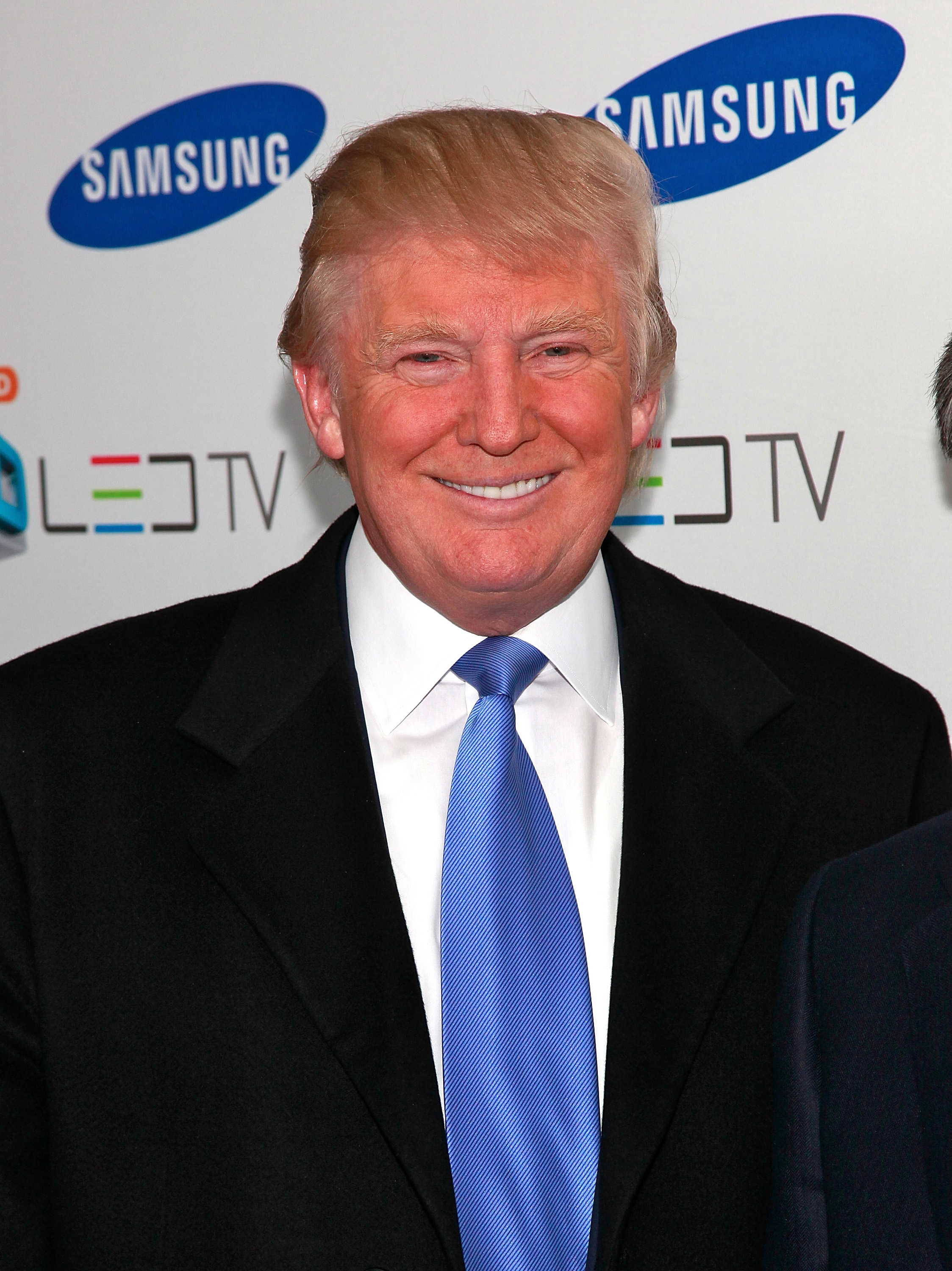 Donald Trump attends The Black Eyed Peas launch the Samsung 3D LED TV on March 10, 2010 | Source: Getty Images