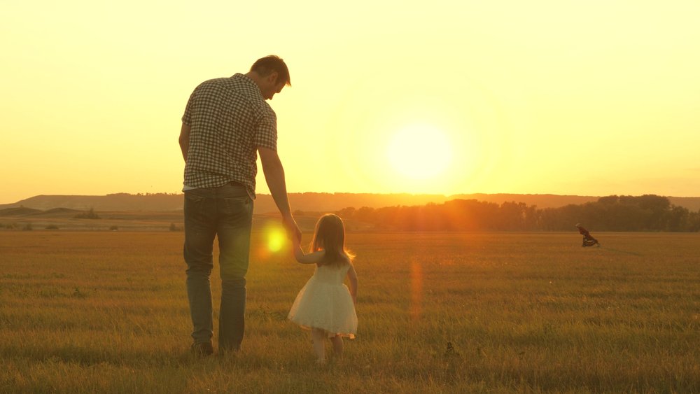 A photo of a father taking a walk with his daughter | Photo: Shutterstock