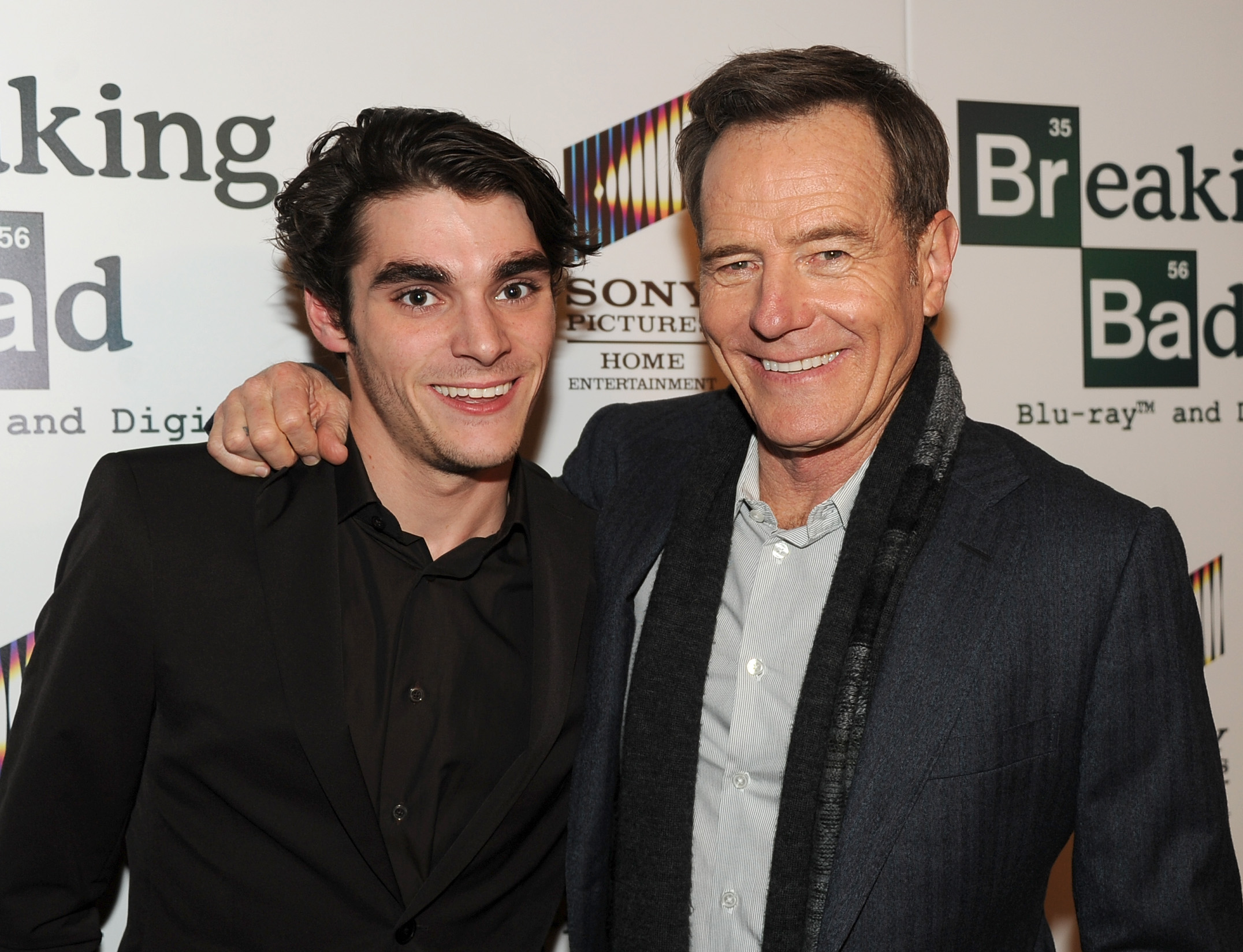 RJ Mitte (L) and Bryan Cranston arrive at the screening of "No Half Measures: Creating The Final Season Of Breaking Bad" DVD Launch at Pacific Theatres at the Grove on November 25, 2013 in Los Angeles, California. | Source: Getty Images