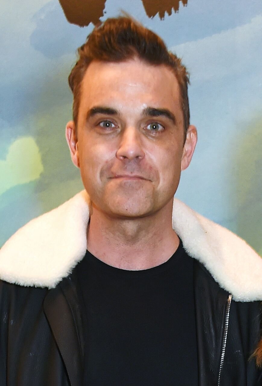 Robbie Williams attends a private view of the David Hockney retrospective at the Tate Britain. | Source: Getty Images