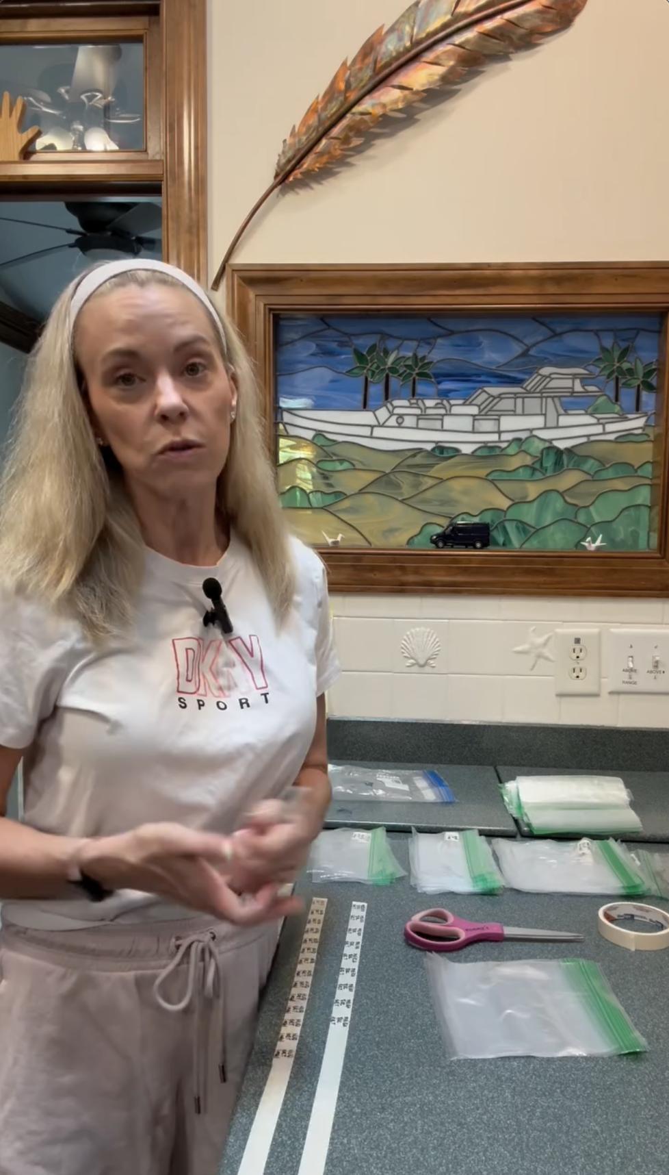 Kate Gosselin appears in her home kitchen wearing a DKNY Sport T-shirt, organizing ziplock bags, labels, and supplies as she walks viewers through her food prep process in a recent Instagram video shared with her followers. | Source: Instagram/kateplusmy8