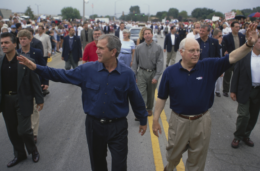 Presidential Candidate George W. Bush and his running mate Dick Cheney wave to supporters during a rally on September 1, 2000 | Source: Getty Images