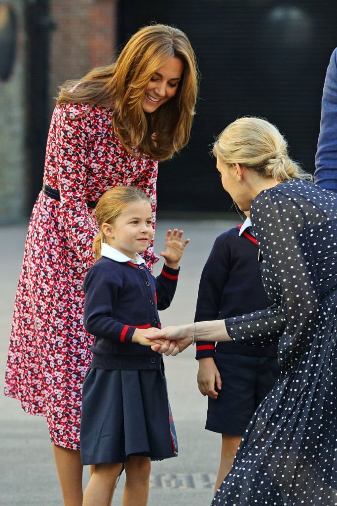 Princess Charlotte and her mother Kate Middleton as they greet a school staff on Charlotte's first day at Thomas's Battersea.| Source: Getty Images
