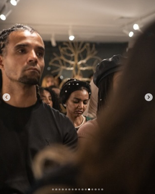 Akala looks serious, listening to the panel discussion at Atelier Jolie in New York City, posted in September 2024 | Source: Instagram.com/atelierjolieofficial