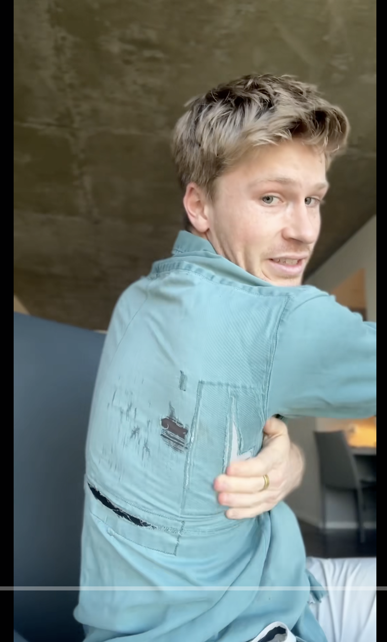 Robert Irwin turns back to show how he got the shirt fixed in a video dated November 16, 2025 | Source: TikTok/robertirwin