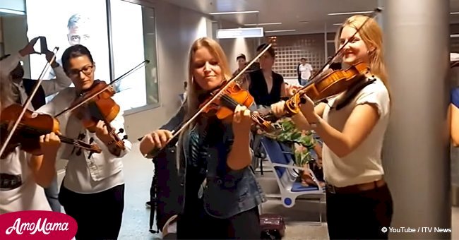 Orchestra didn't lose its grip during a flight delay and entertained passengers at the airport