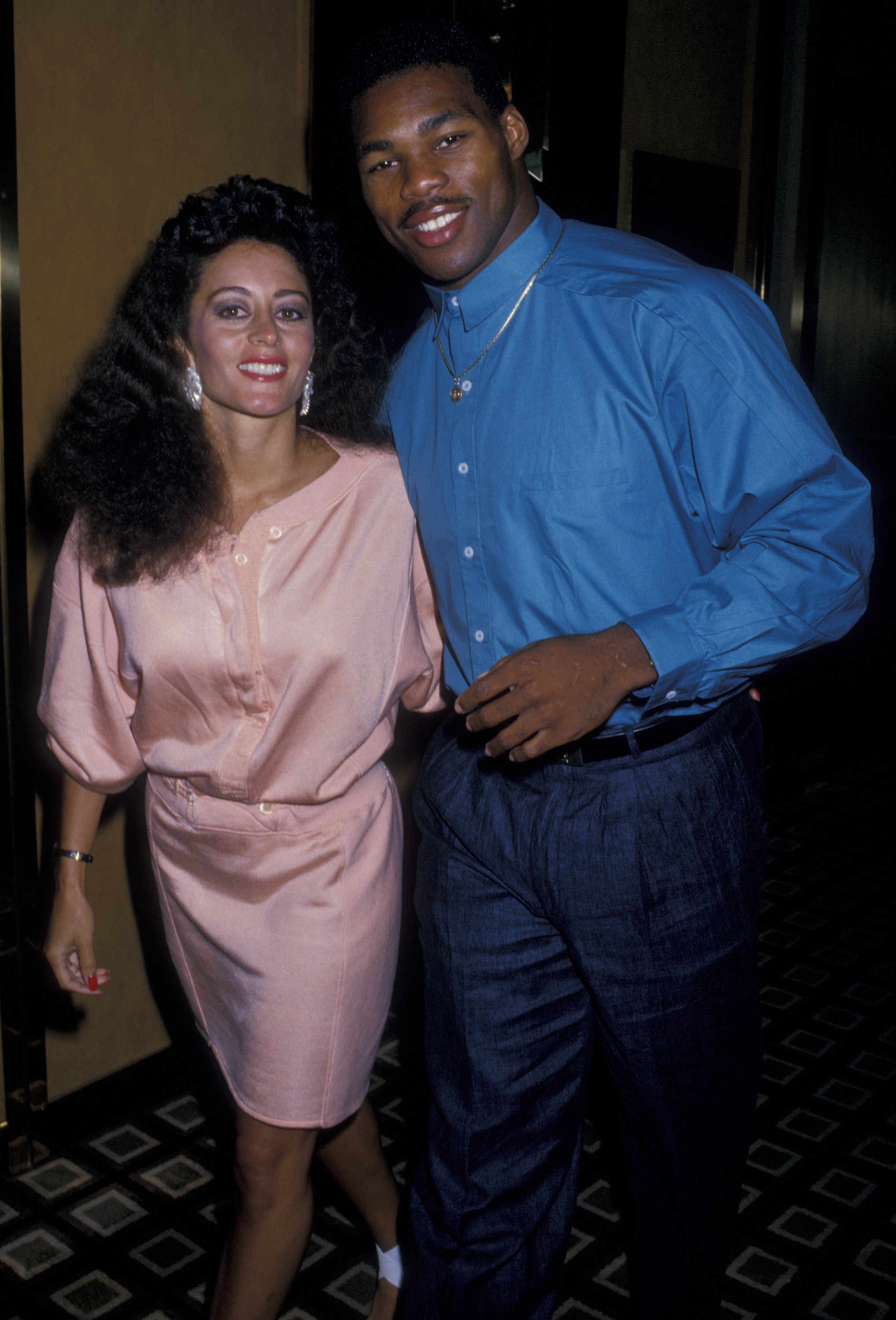 Cindy DeAngelis Grossman and Herschel Walker at the Tyson vs. Spinks Boxing Match on June 27, 1988, in New Jersey. | Source: Getty Images