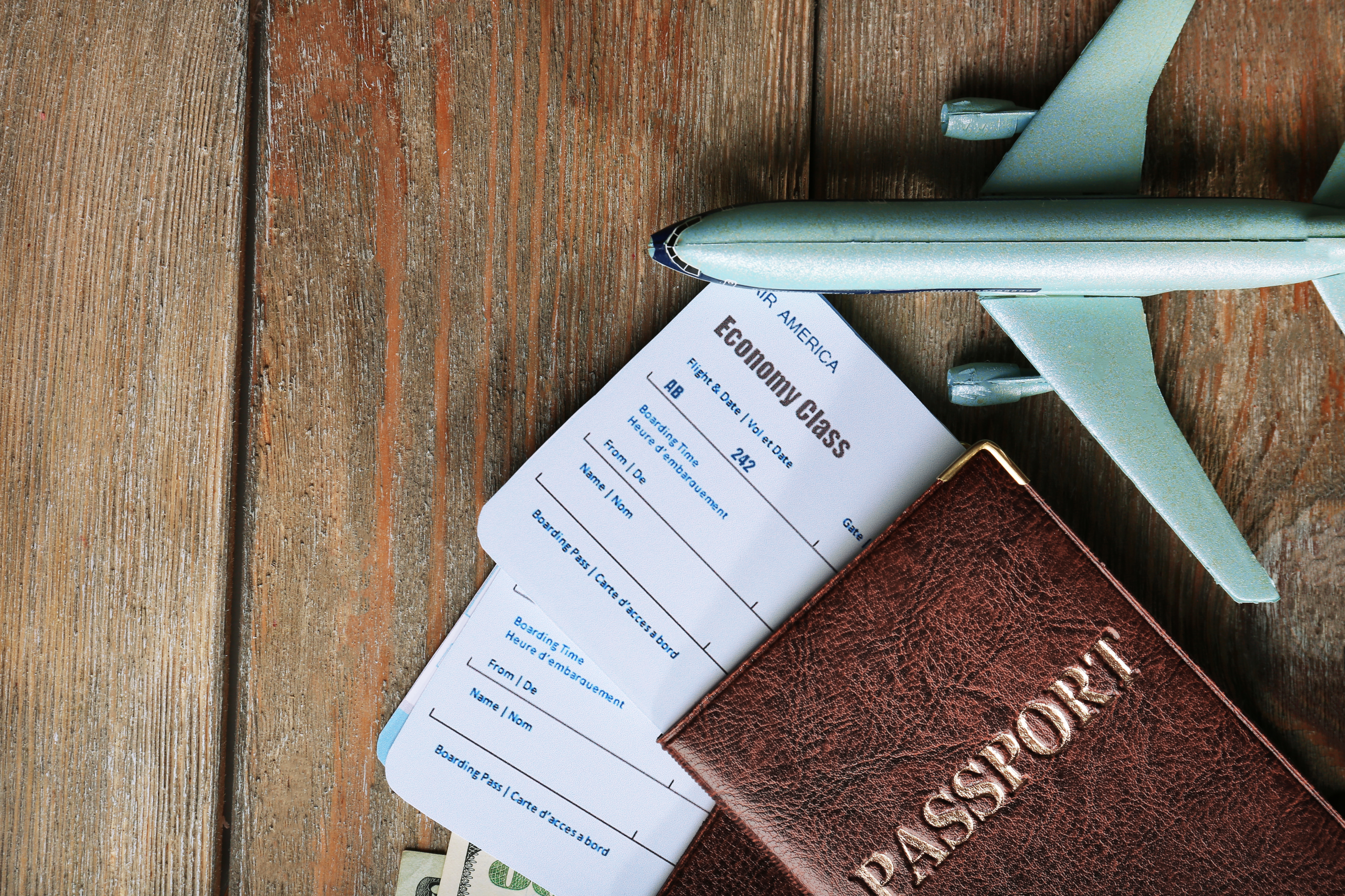 Two passports with plane tickets and a plane figurine | Source: Shutterstock