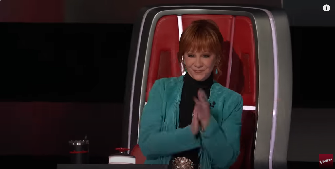 Coach Reba McEntire enjoys the DEK of Hearts performance on The Voice Season 28 premiere, from a post dated September 23, 2025 | Source: YouTube/The Voice