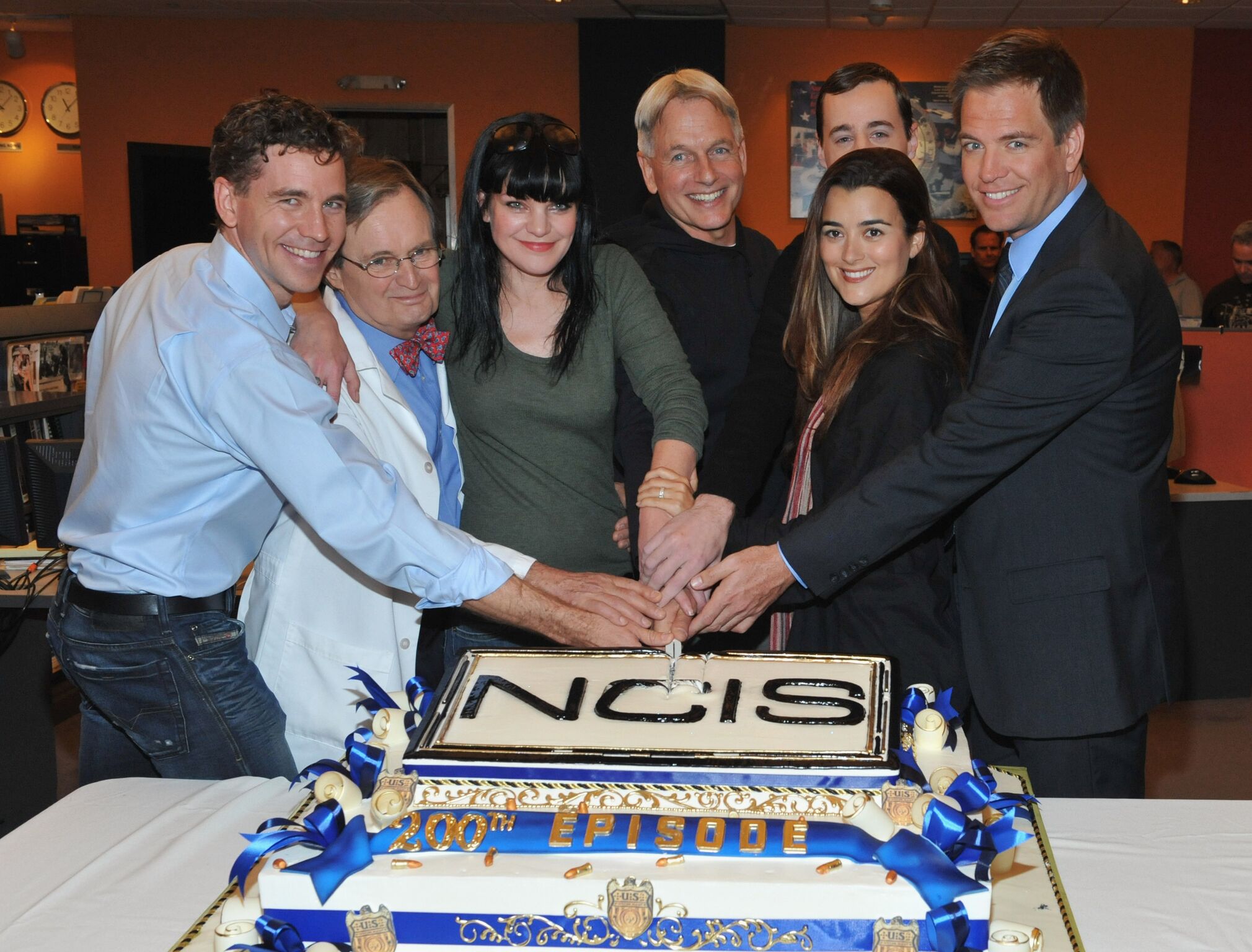 Actors Brian Dietzen, David McCallum, Pauley Perrette, Mark Harmon, Sean Murray Cote de Pablo and Michael Weatherly pose at CBS' "NCIS" celebration | Getty Images
