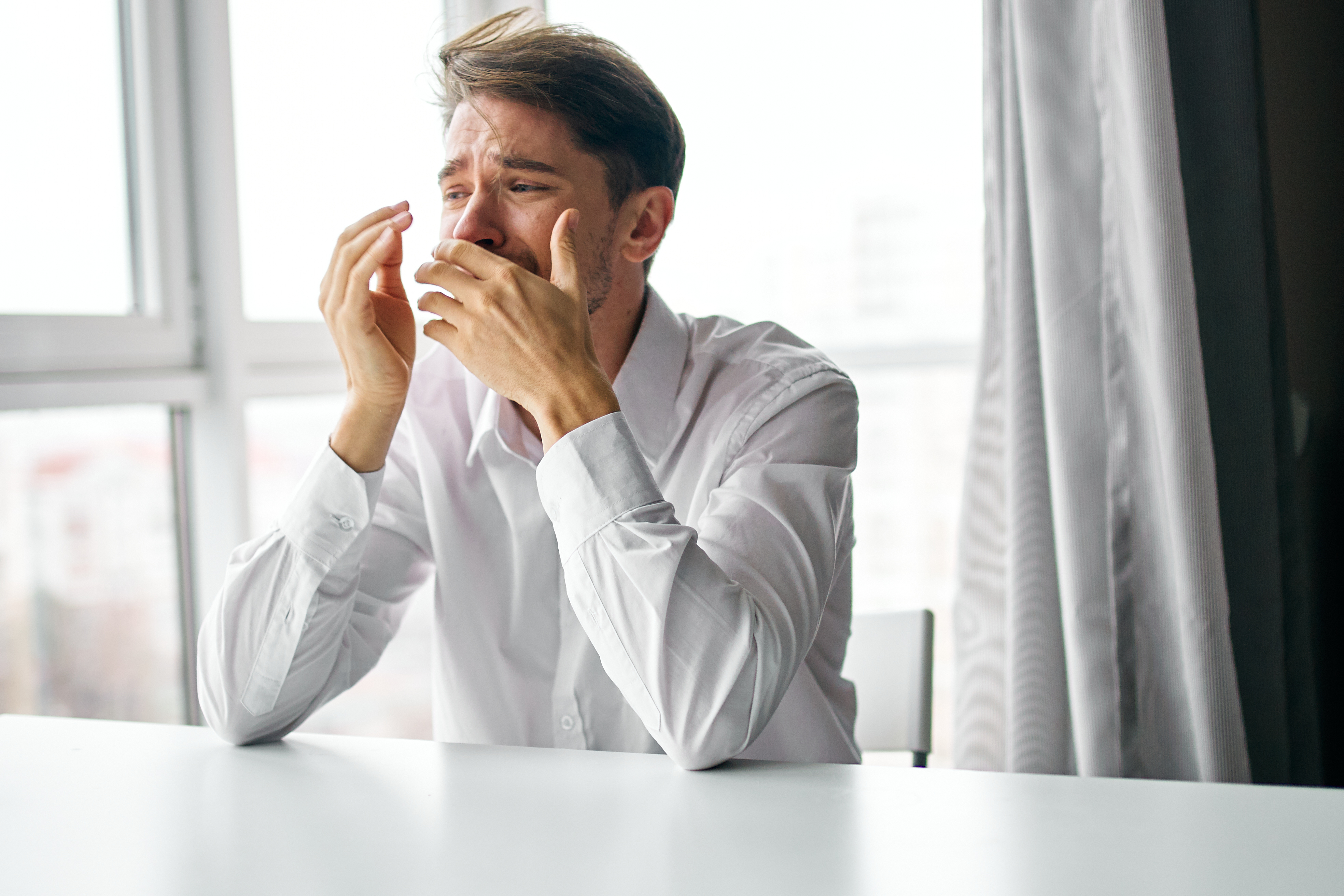 An emotional man crying | Source: Shutterstock