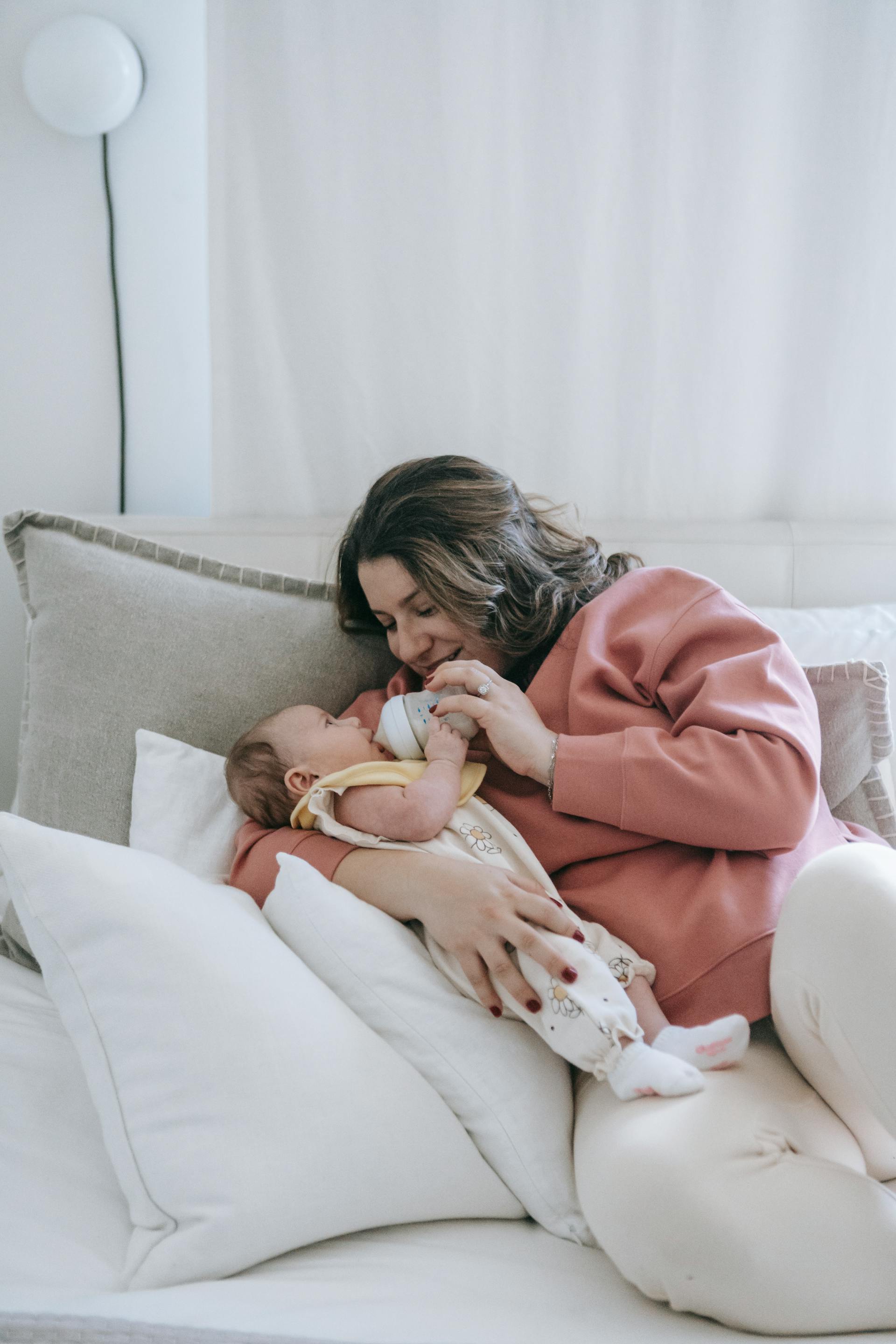 A woman feeding a baby | Source: Pexels