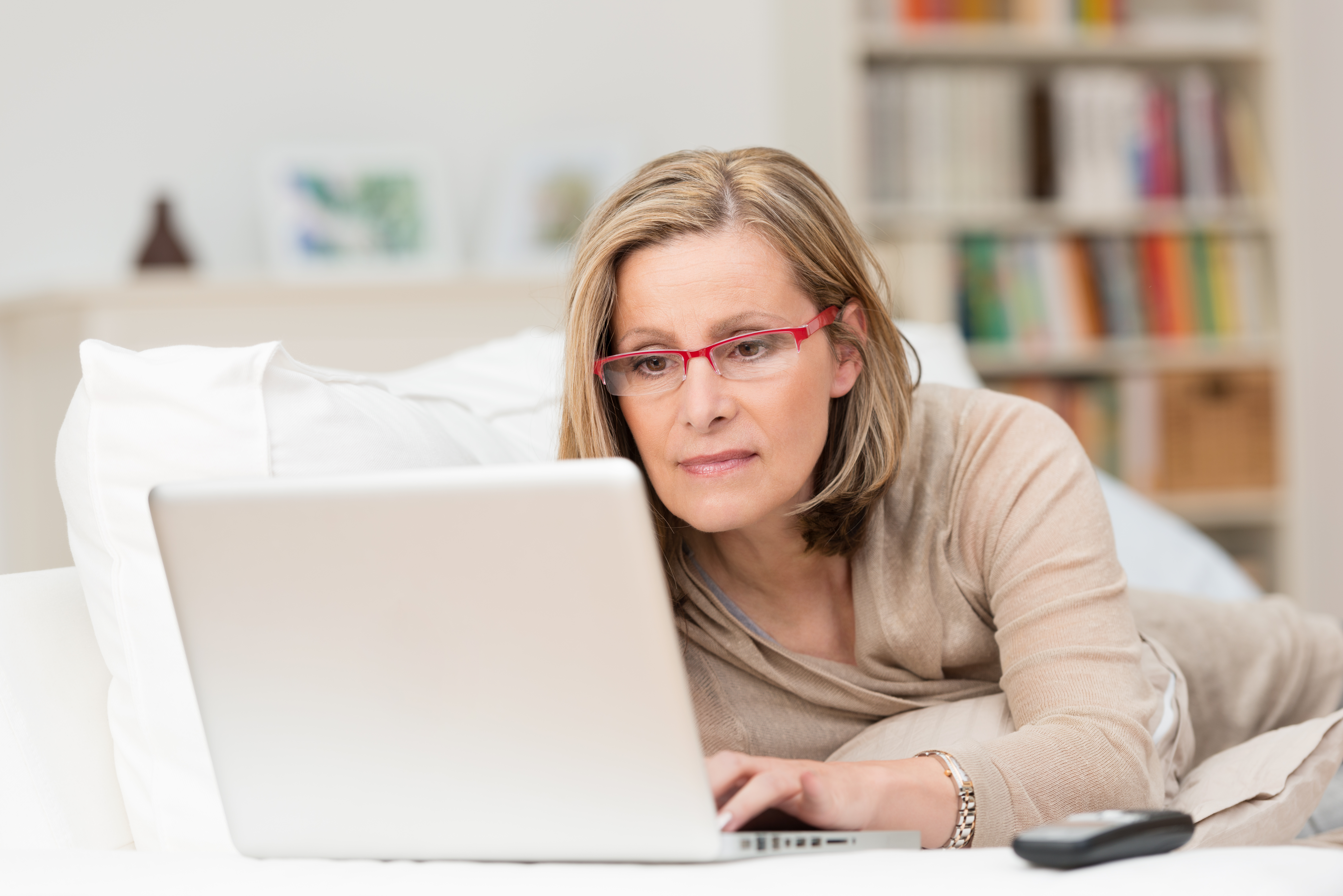 Middle-aged woman working on a laptop | Source: Shutterstock