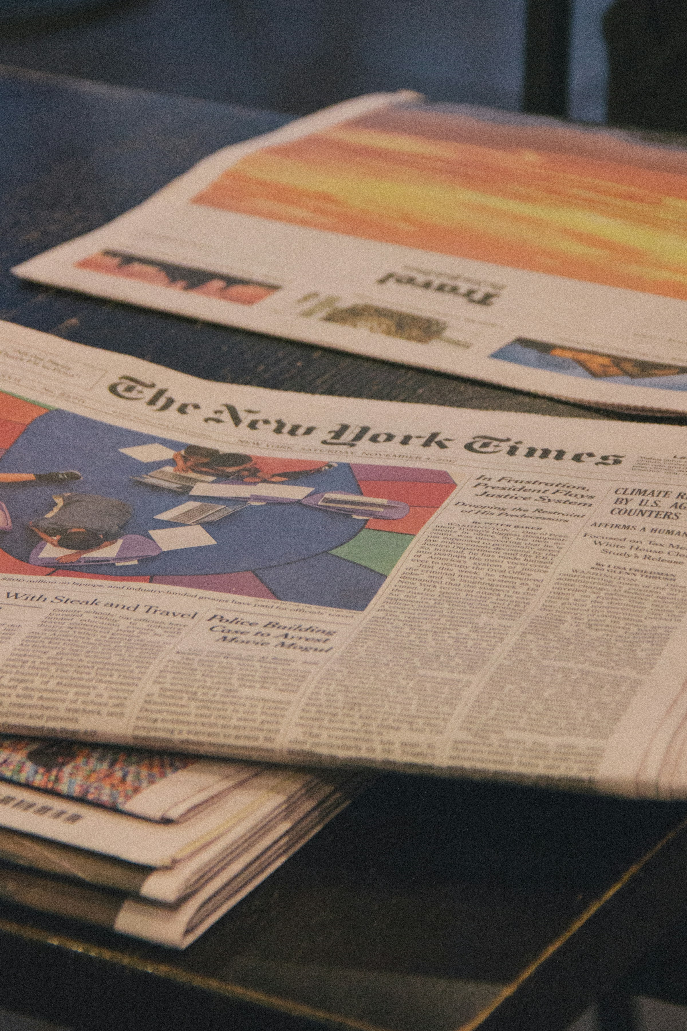 Newspapers lying on a table | Source: Unsplash