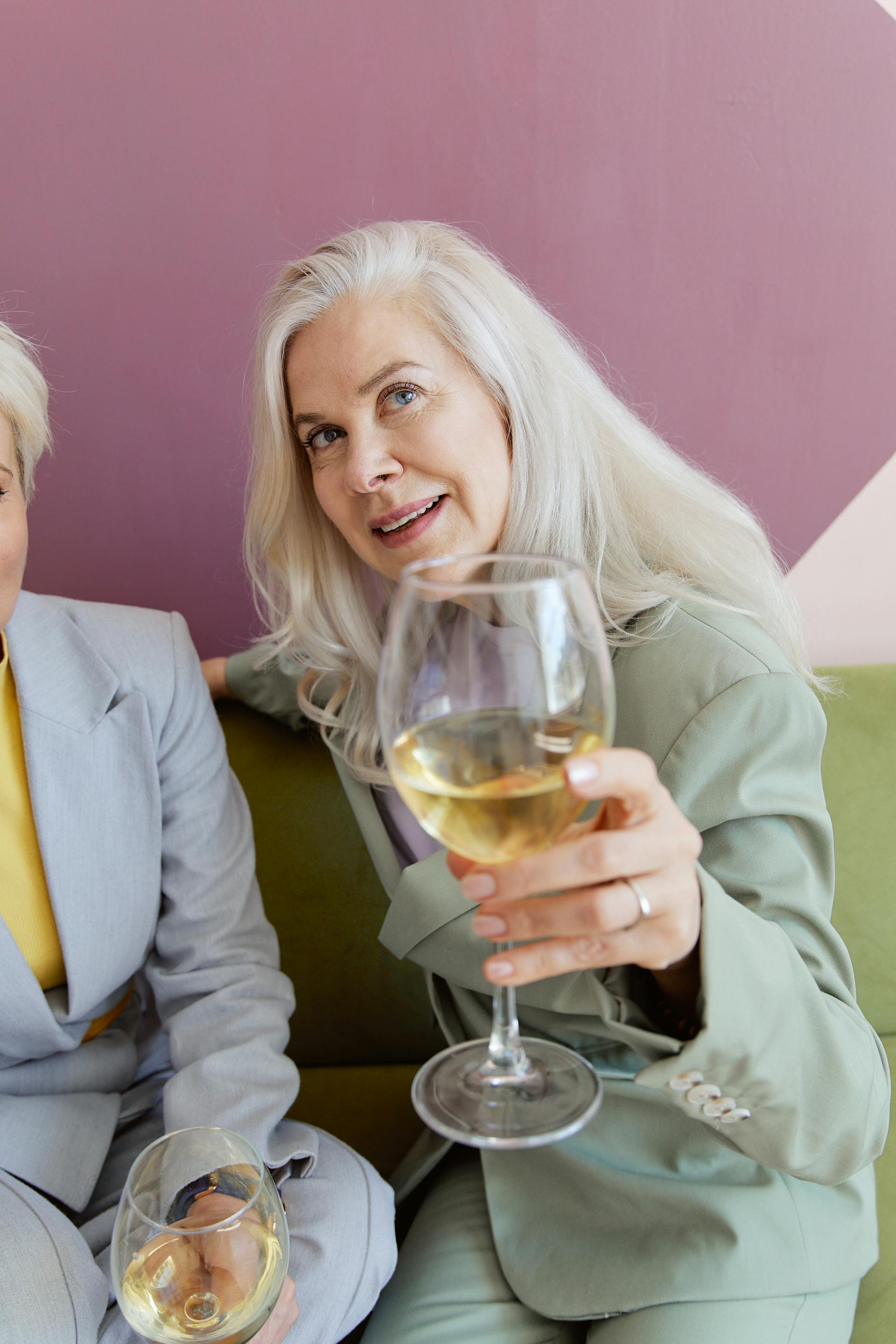 A senior woman holding a wine glass | Source: Pexels