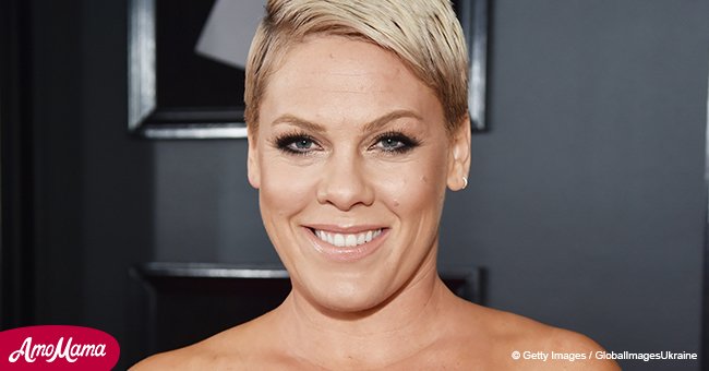 Pink shows off unflattering skin-tight outfit swinging through the air 