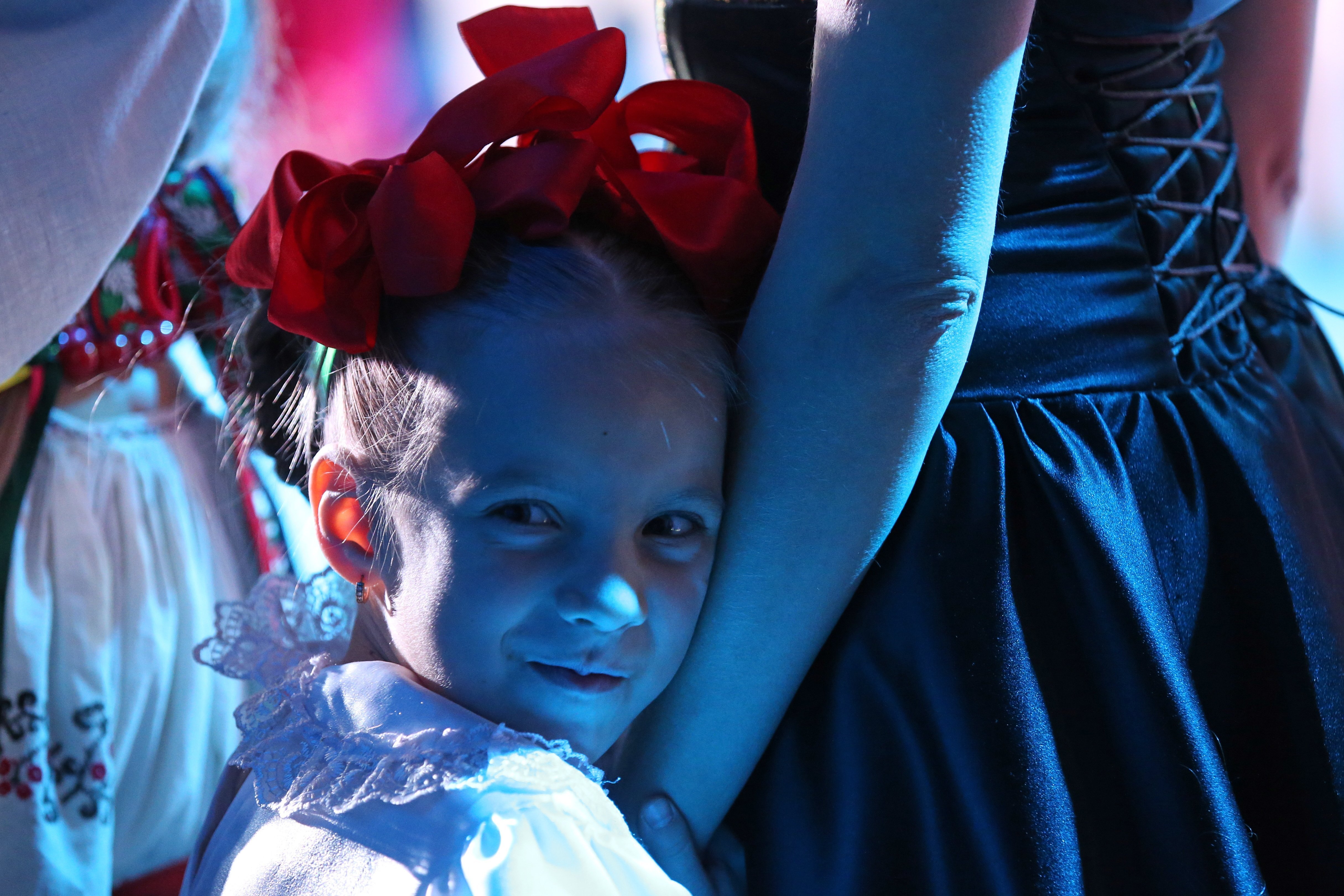 A woman and a girl during the Best Mum Competition in the city of Simferopol, Crimea, Russia; the event, which aims at promoting responsible motherhood, marks the upcoming Mother's Day.|Photo: Getty Images