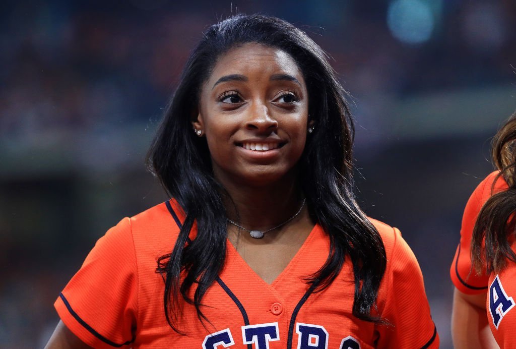  Gymnast Simone Biles looks on prior to Game Two of the 2019 World Series between the Houston Astros and the Washington Nationals at Minute Maid Park on October 23, 2019. | Photo: Getty Images