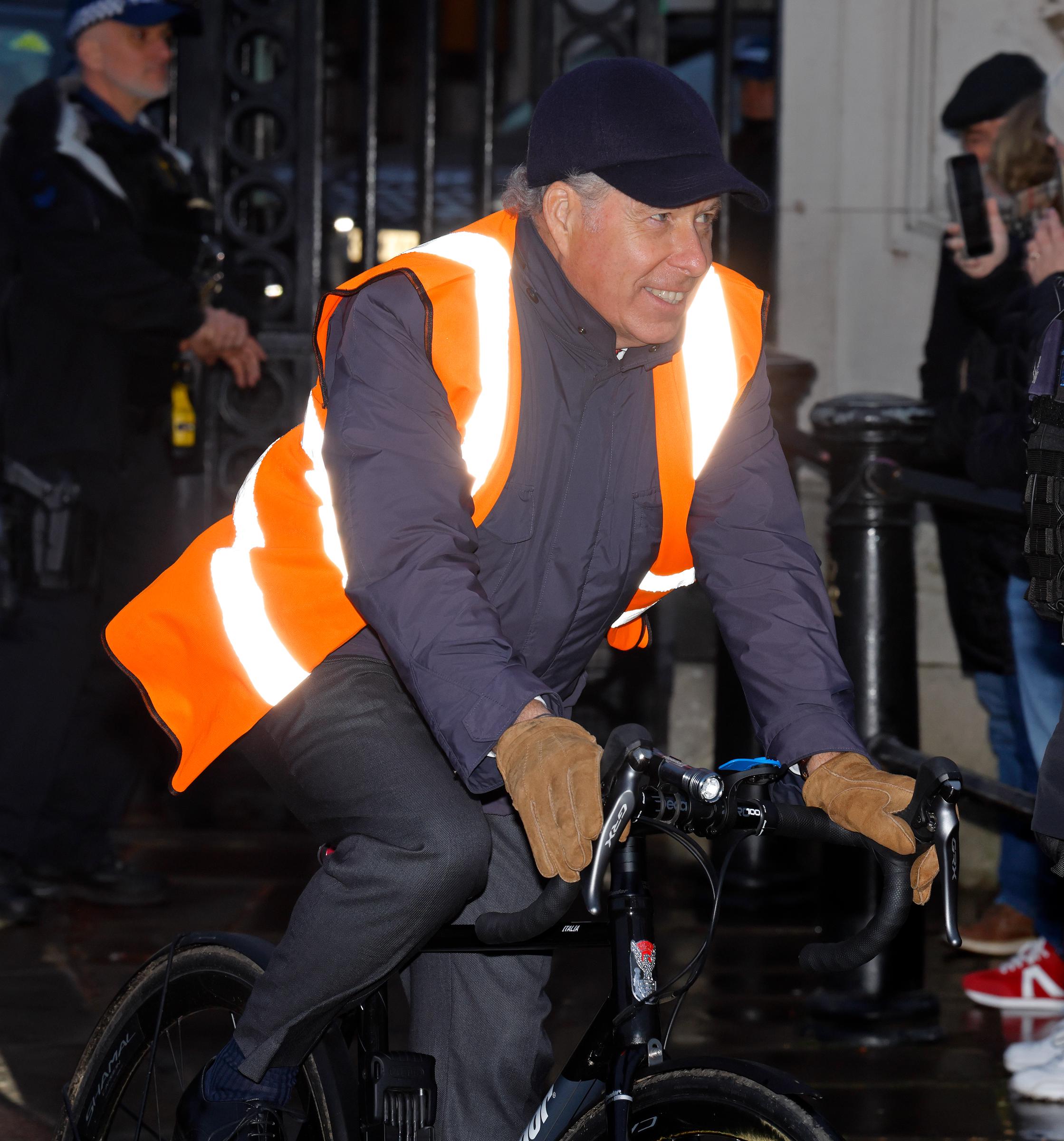 As he approached the entrance, the King's nephew flashed a cheerful smile — unaware, perhaps, that his cycling arrival would spark a flurry of online speculation and admiration, with one person even mistaking him for Andrew Mountbatten-Windsor.