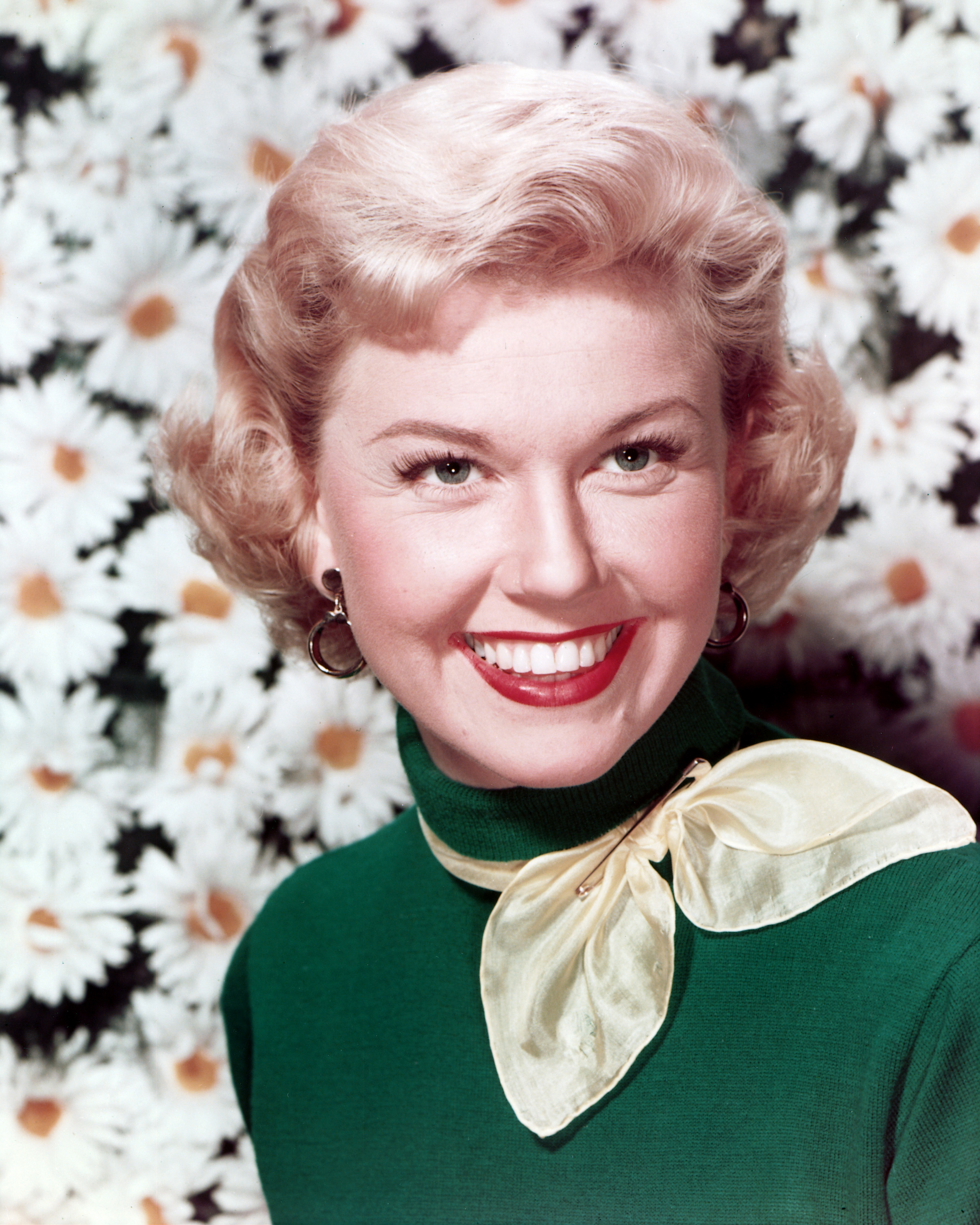 Actress Doris Day pictured smiling in a green sweater on January 1, 1960 | Source: Getty Images