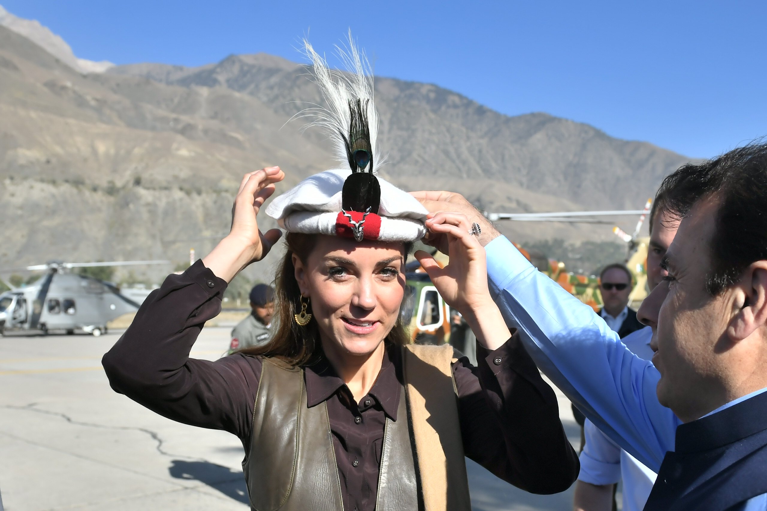 Prince William and Kate Middleton are welcomed as they arrive by helicopter on October 16, 2019, in Chitral, Pakistan. | Source: Getty Images.