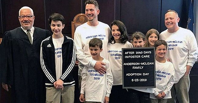 Rob and Steve Anderson-McLean pictured with the six siblings on the adoption day. | Photo: twitter.com/GMA 