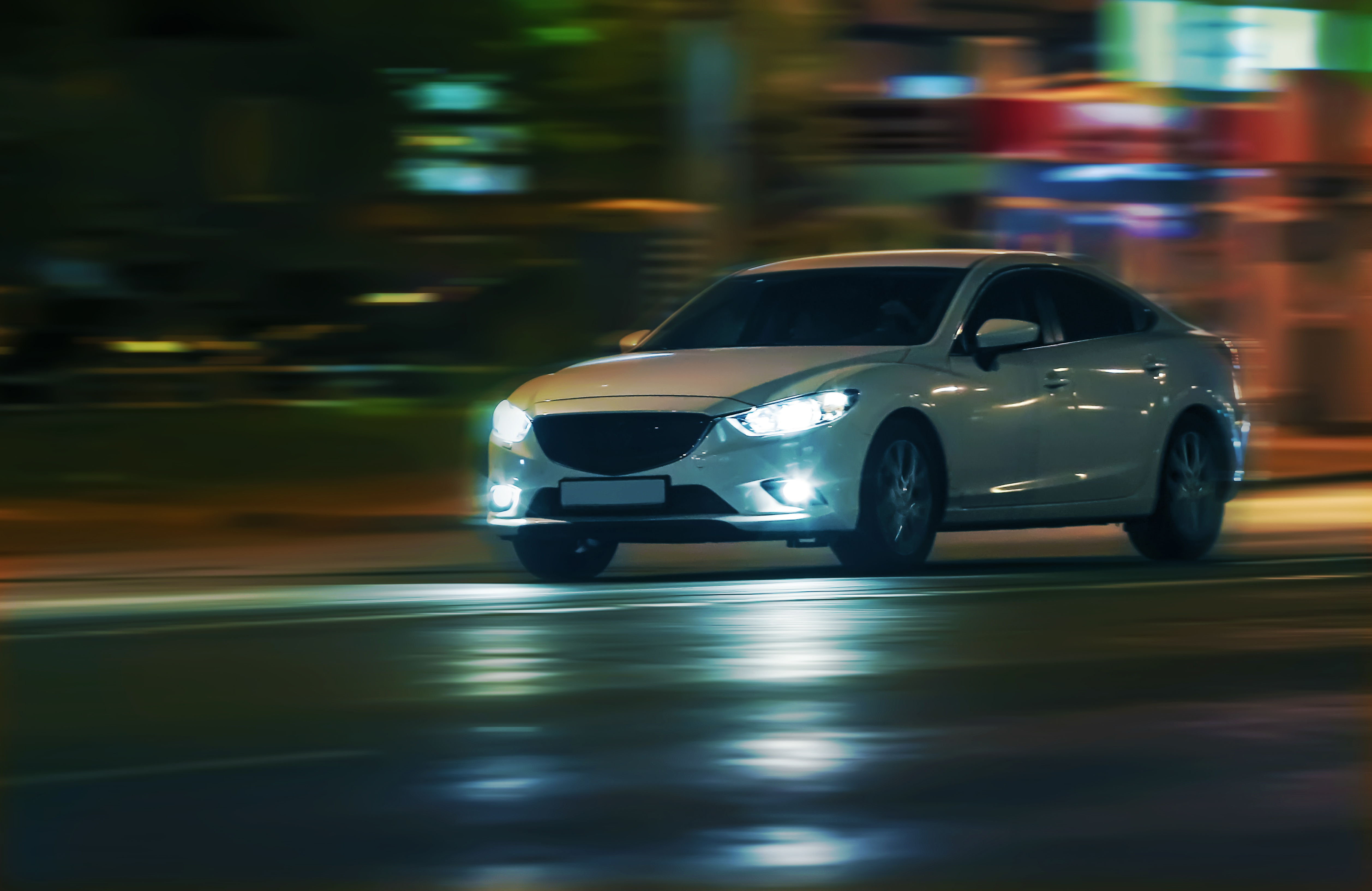Car on night road. | Source: Shutterstock
