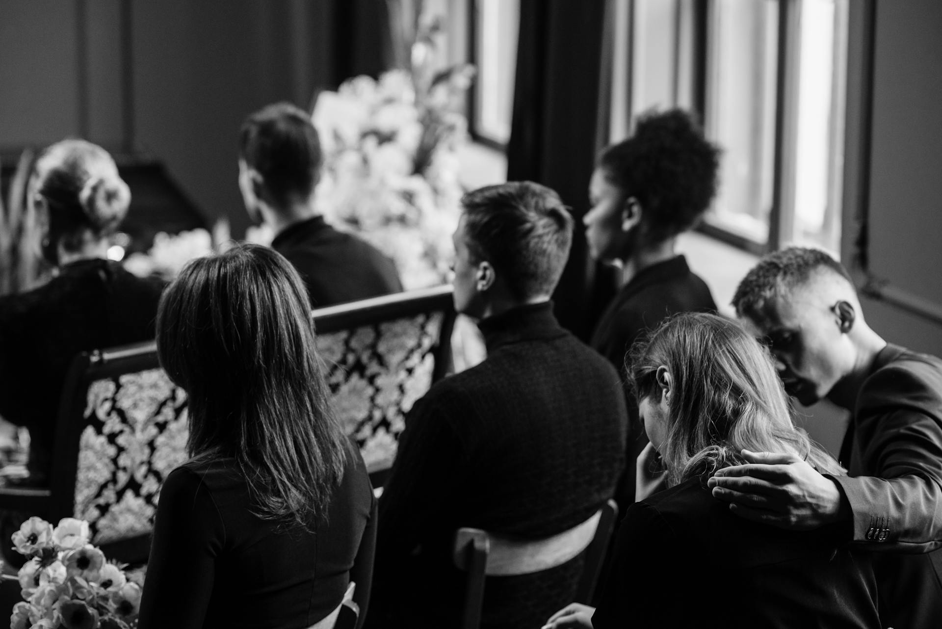 Grayscale of people gathered at a funeral | Source: Pexels