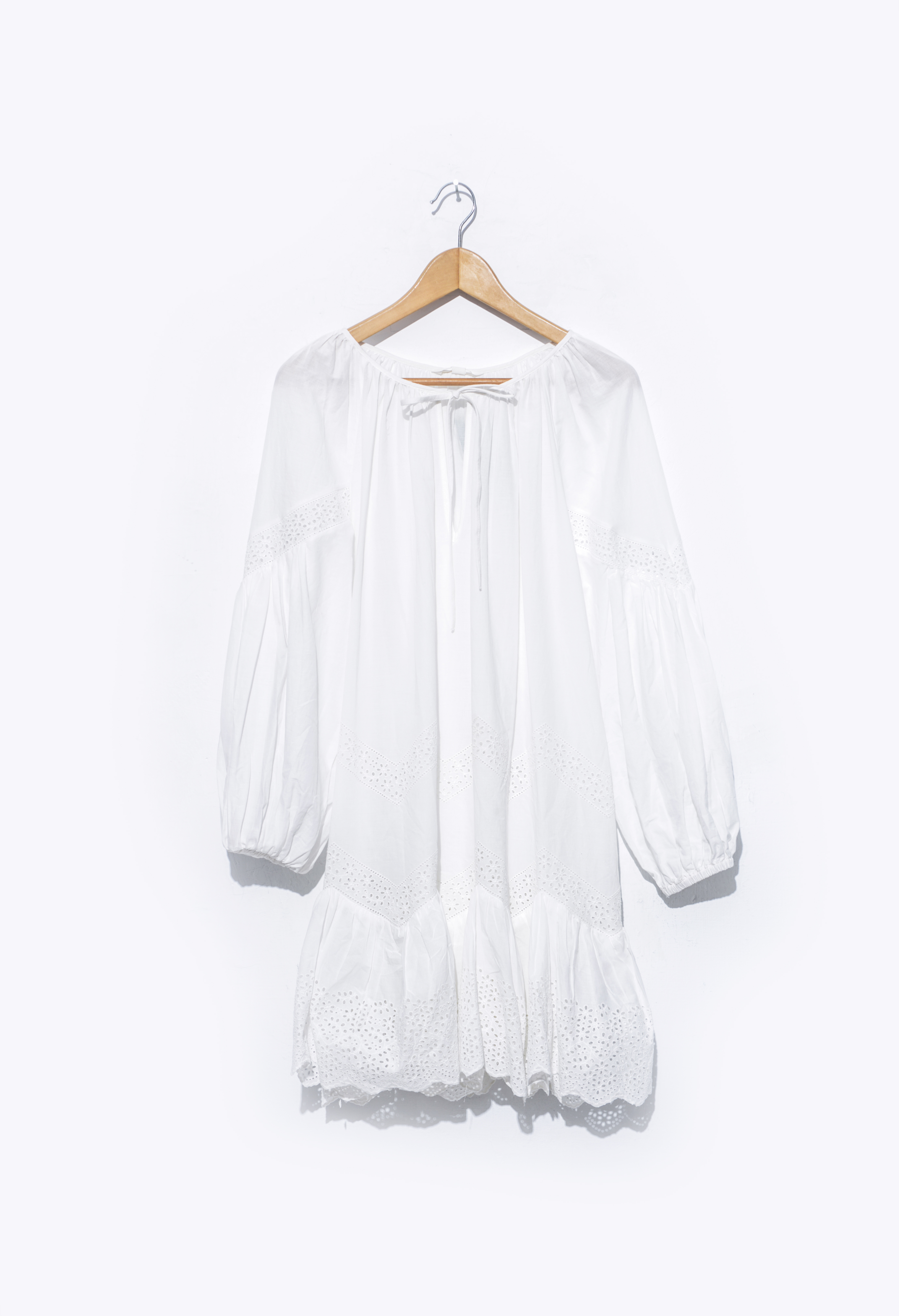 A white dress on a hanger | Source: Shutterstock