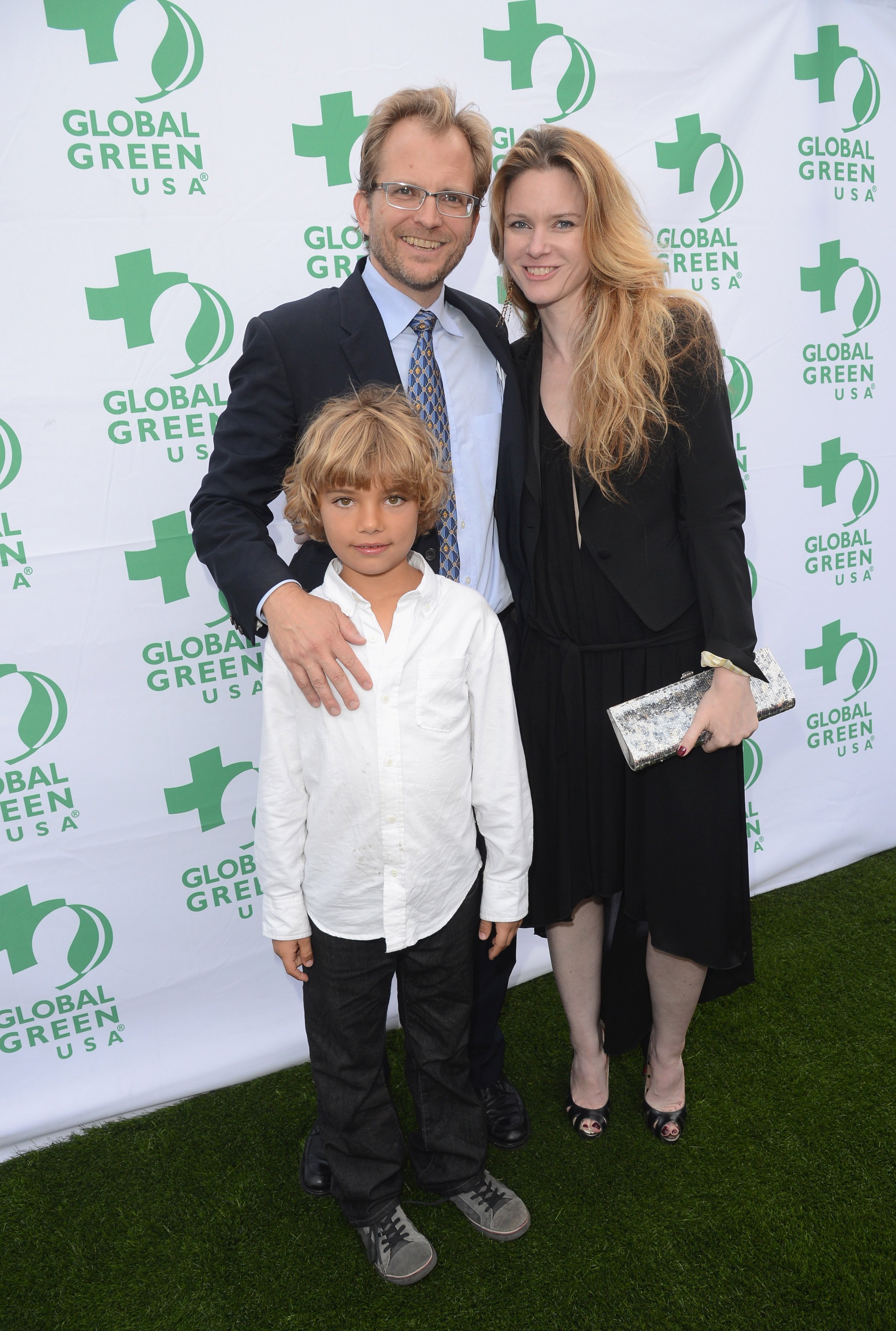 Matt Petersen and Justine Musk pose with a young boy at the 16th Annual Global Green USA Millennium Awards held at Fairmont Miramar Hotel on June 2, 2012, in Santa Monica, California | Source: Getty Images