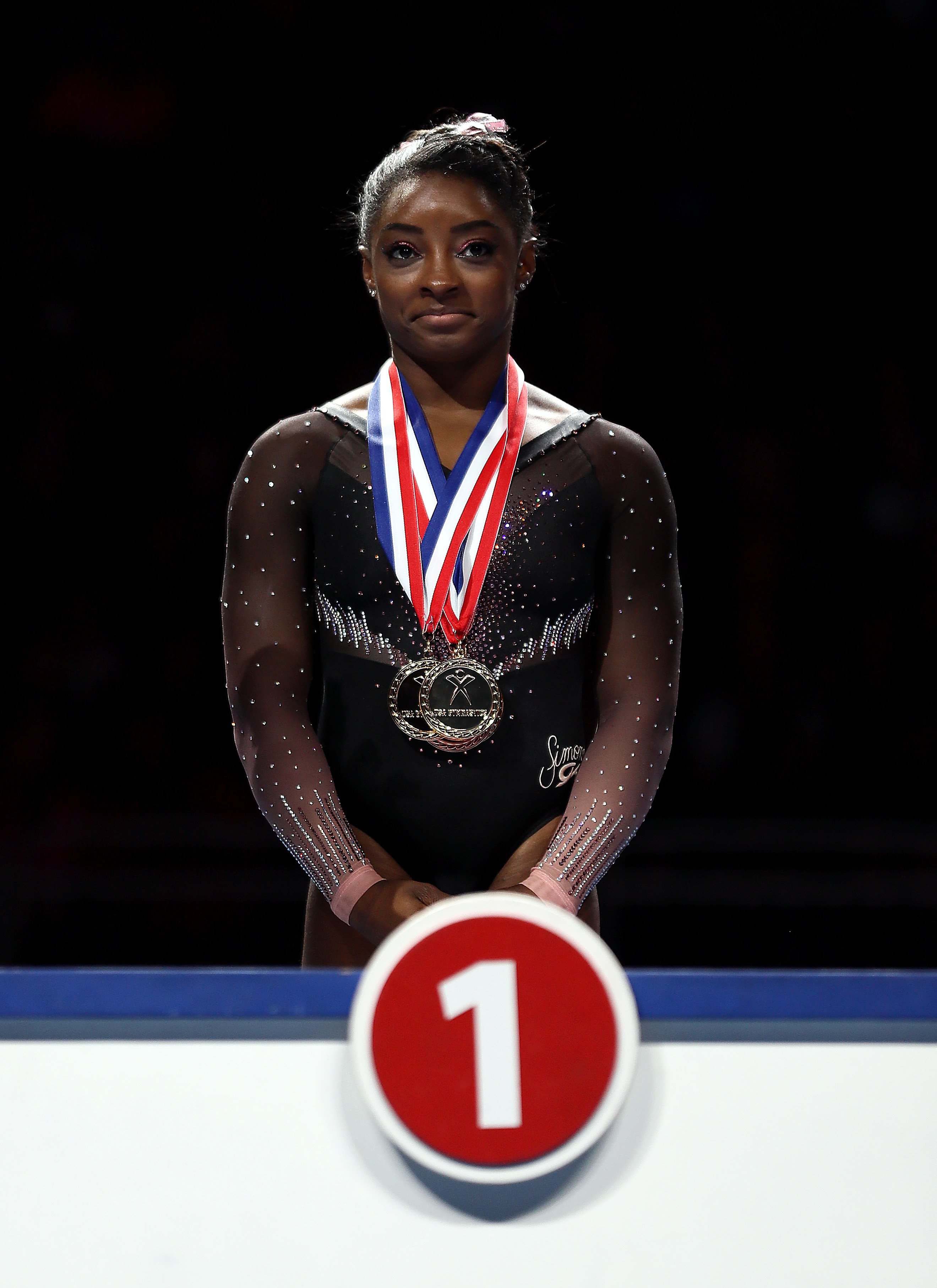 Simone Biles on the podium after accepting her gold medal during the Women's Senior competition at the 2019 US Gymnastics Championships on August 11, 2019. | Photo: Getty Images