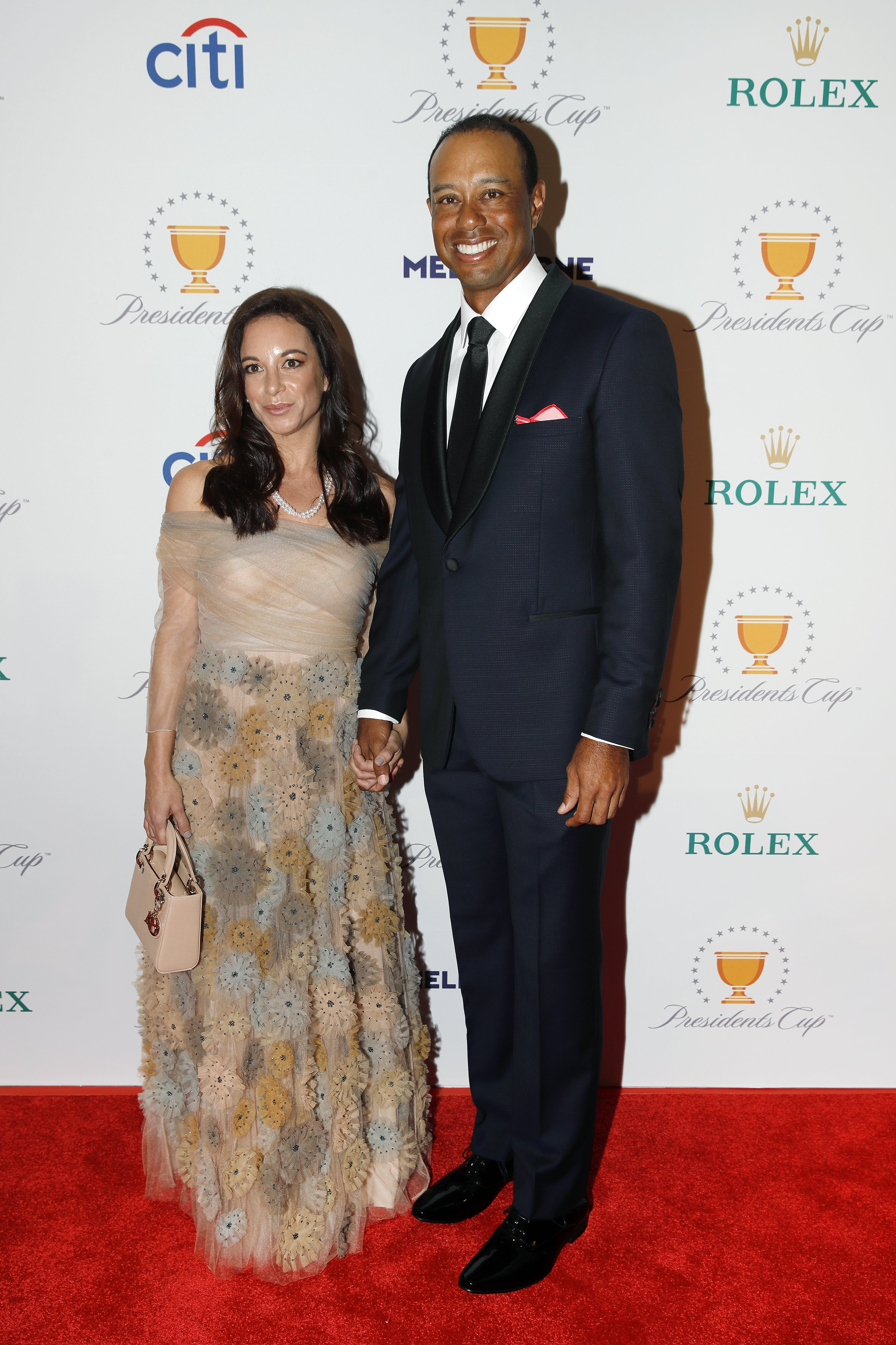 Tiger Woods and his girlfriend, Erica Herman, pose on the red carpet during the Presidents Cup Gala prior to Presidents Cup at The Royal Melbourne Golf Club on December 10, 2019, in Melbourne, Australia. | Source: Getty Images