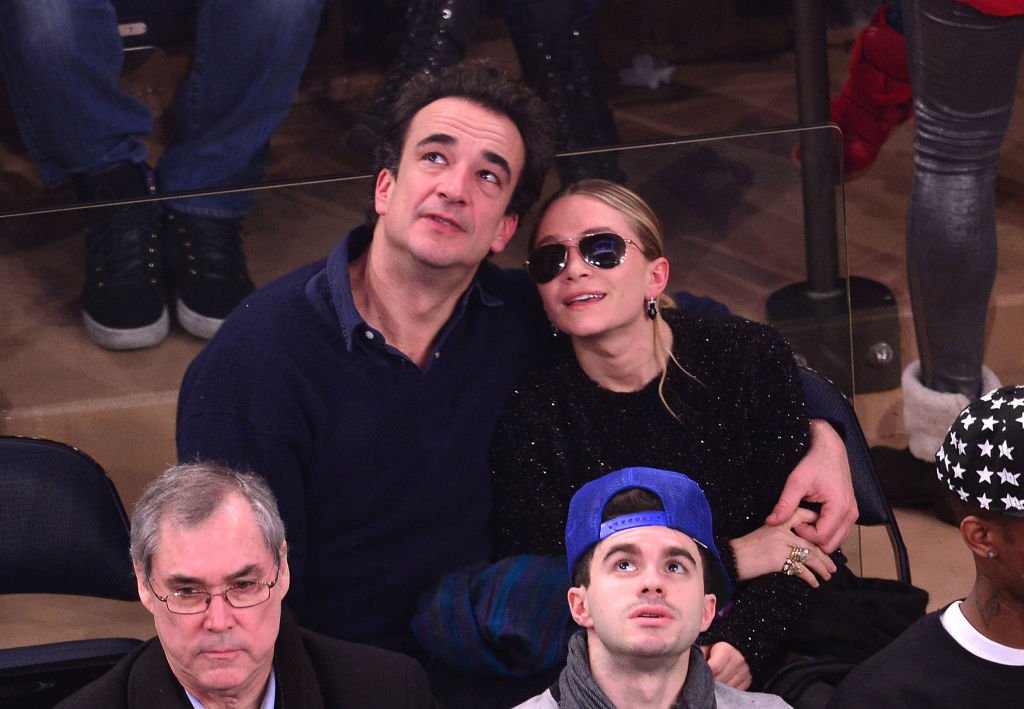 Mary-Kate Olsen and Olivier Sarkozy attend the New York Knicks vs Atlanta Hawks game in New York City on December 14, 2013 | Photo: Getty Images