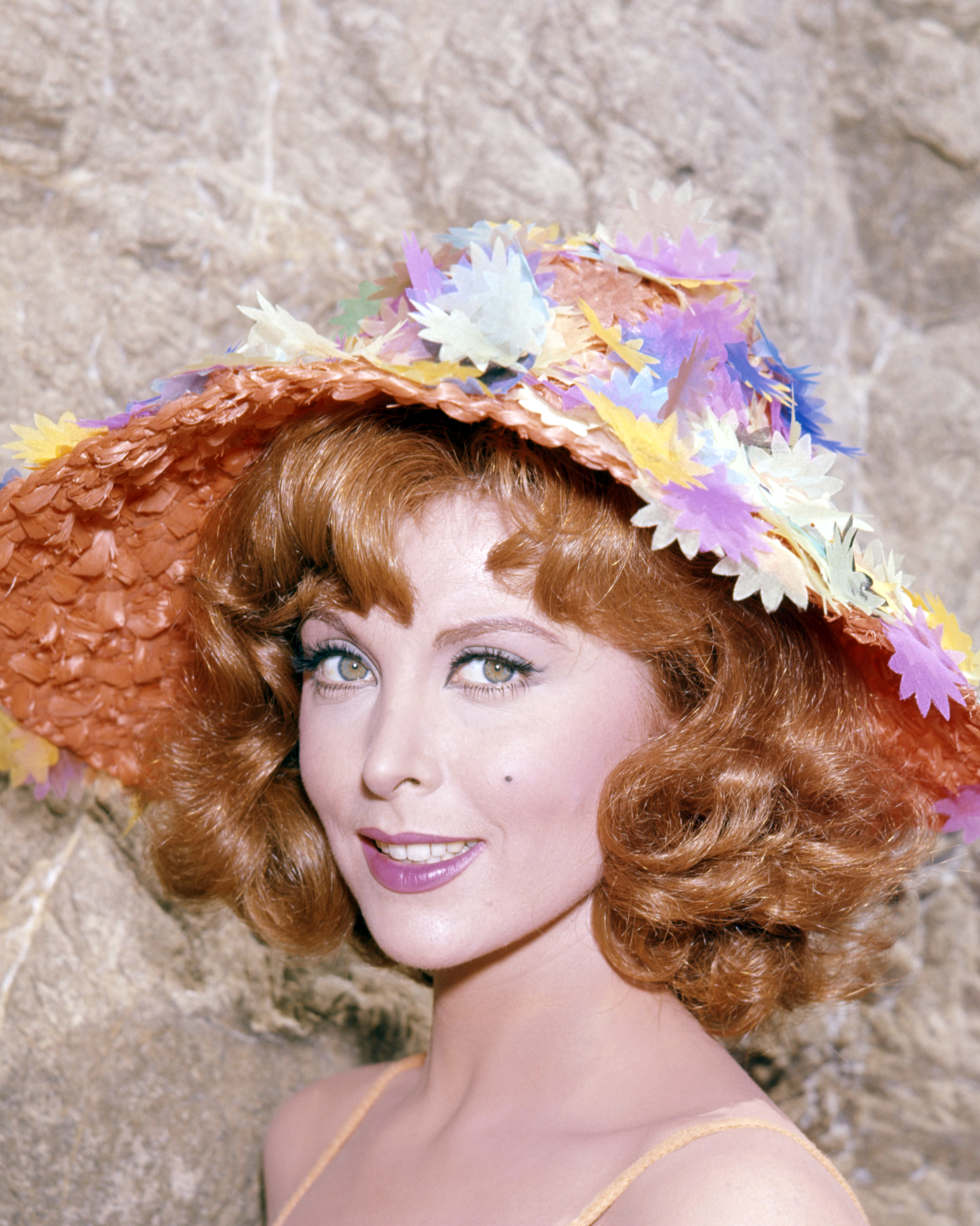 American actress Tina Louise wearing a multi-coloured sunhat, circa 1965 | Source: Getty Images