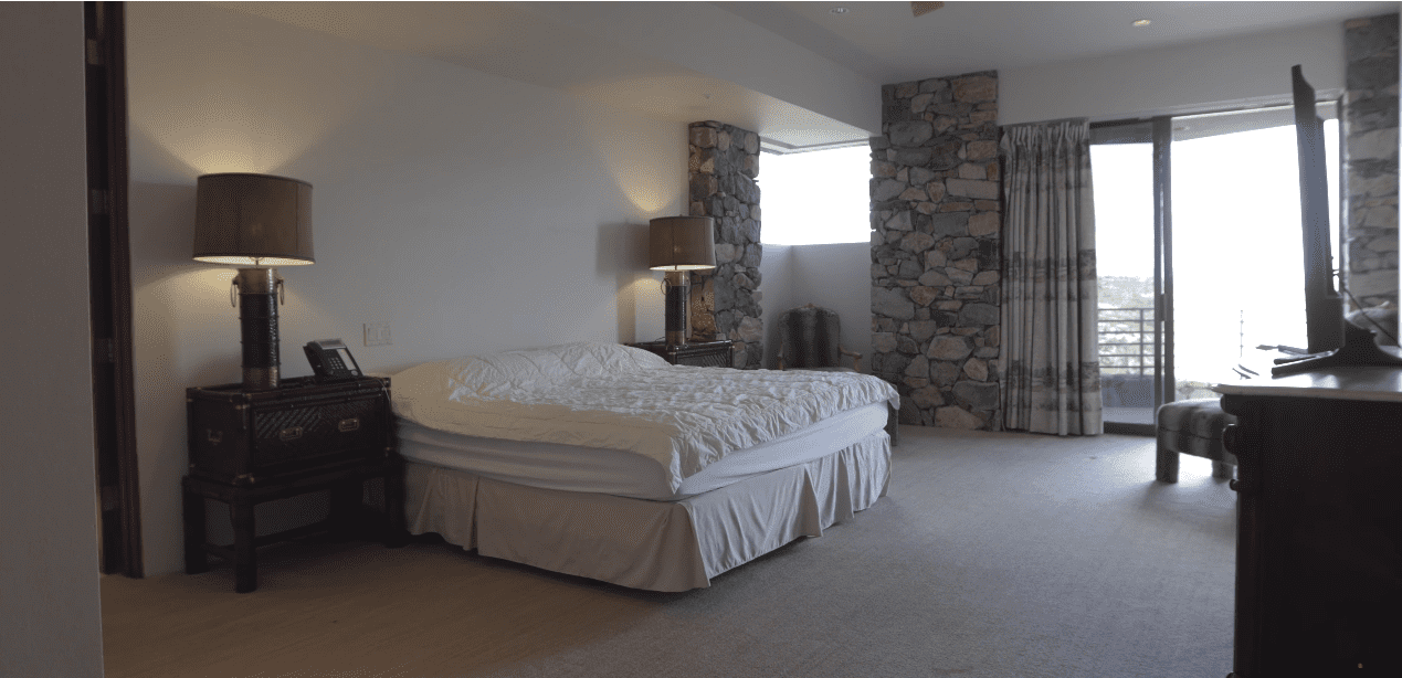 The master bedroom features panoramic views of the outdoors | Source: YouTube/ Paul Benson Engel & Völkers