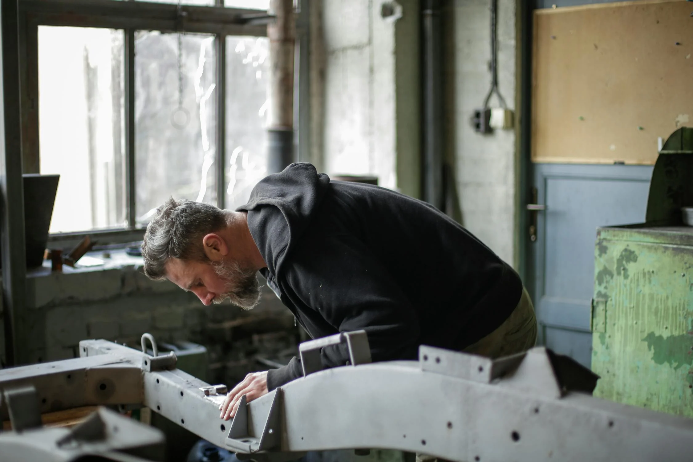 A mature man in his garage | Source: Pexels