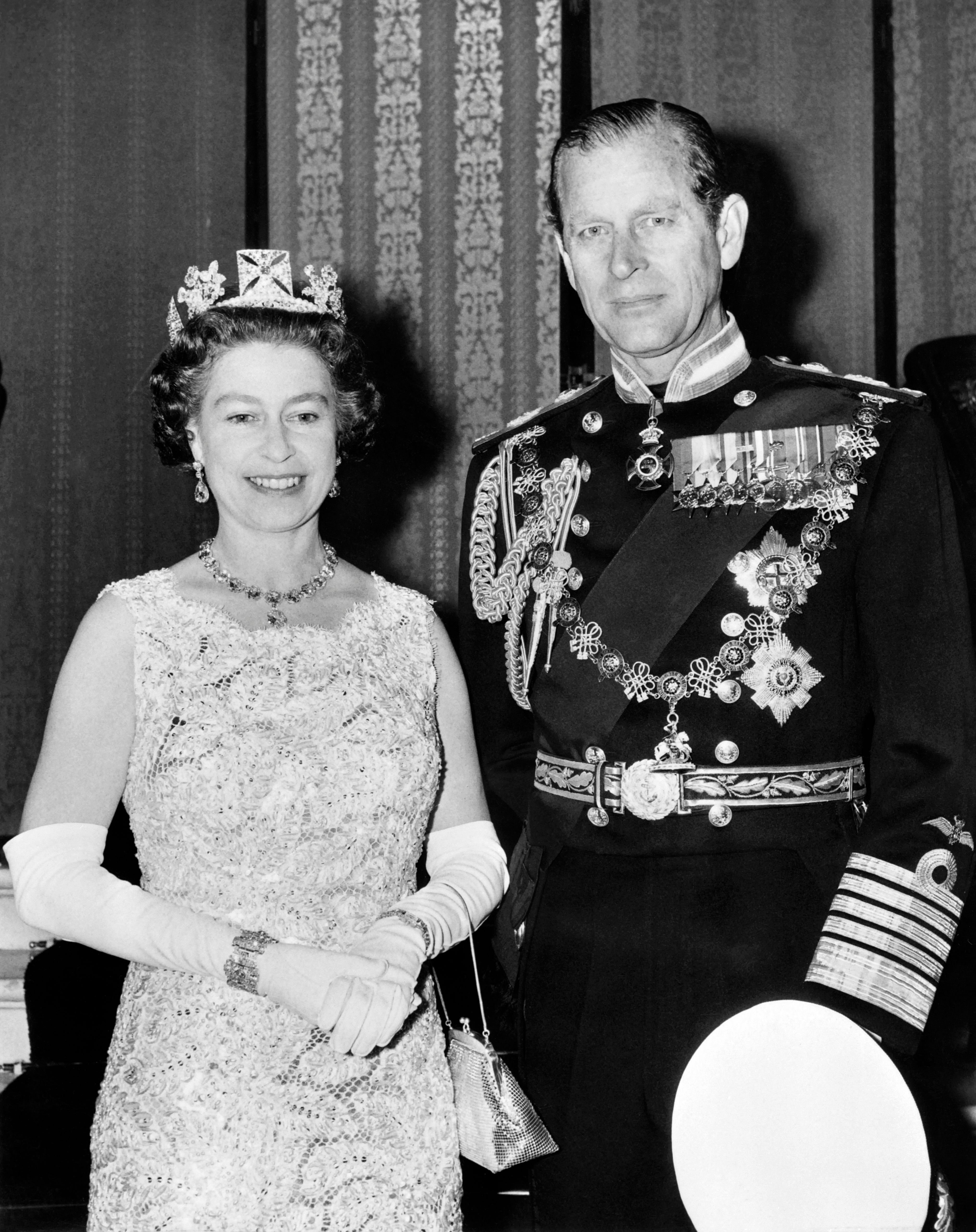 Britain's Queen Elizabeth II, wearing the George IV State Diadem, diamond tiara on British and Commonwealth stamps, and Prince Philip, Duke of Edinburgh, on their 25th wedding anniversary. | Source: Getty Images