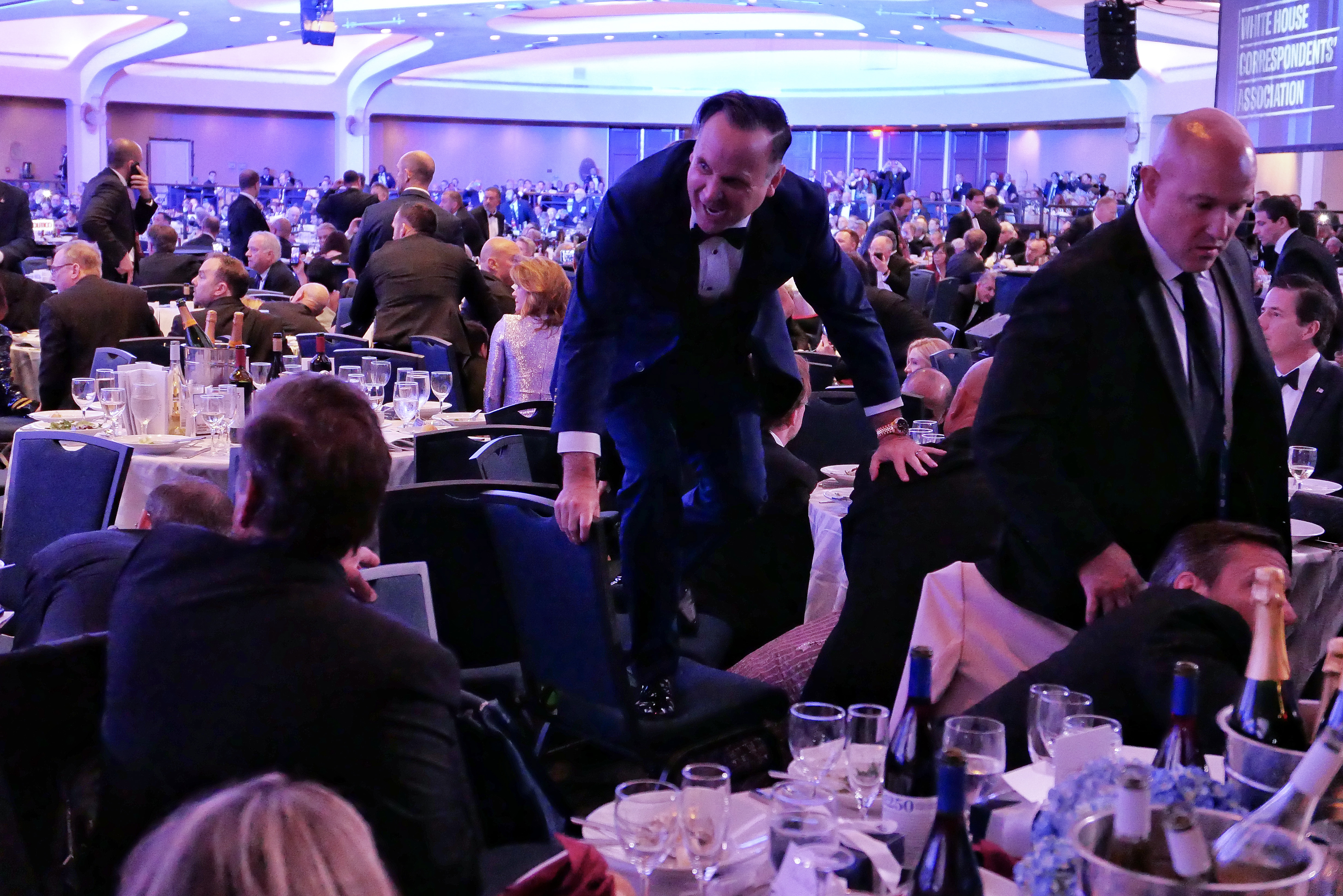 Dan Scavino jumps over a chair after an incident at the White House Correspondents Association dinner at the Washington Hilton on April 25, 2026, in Washington, DC | Source: Getty Images